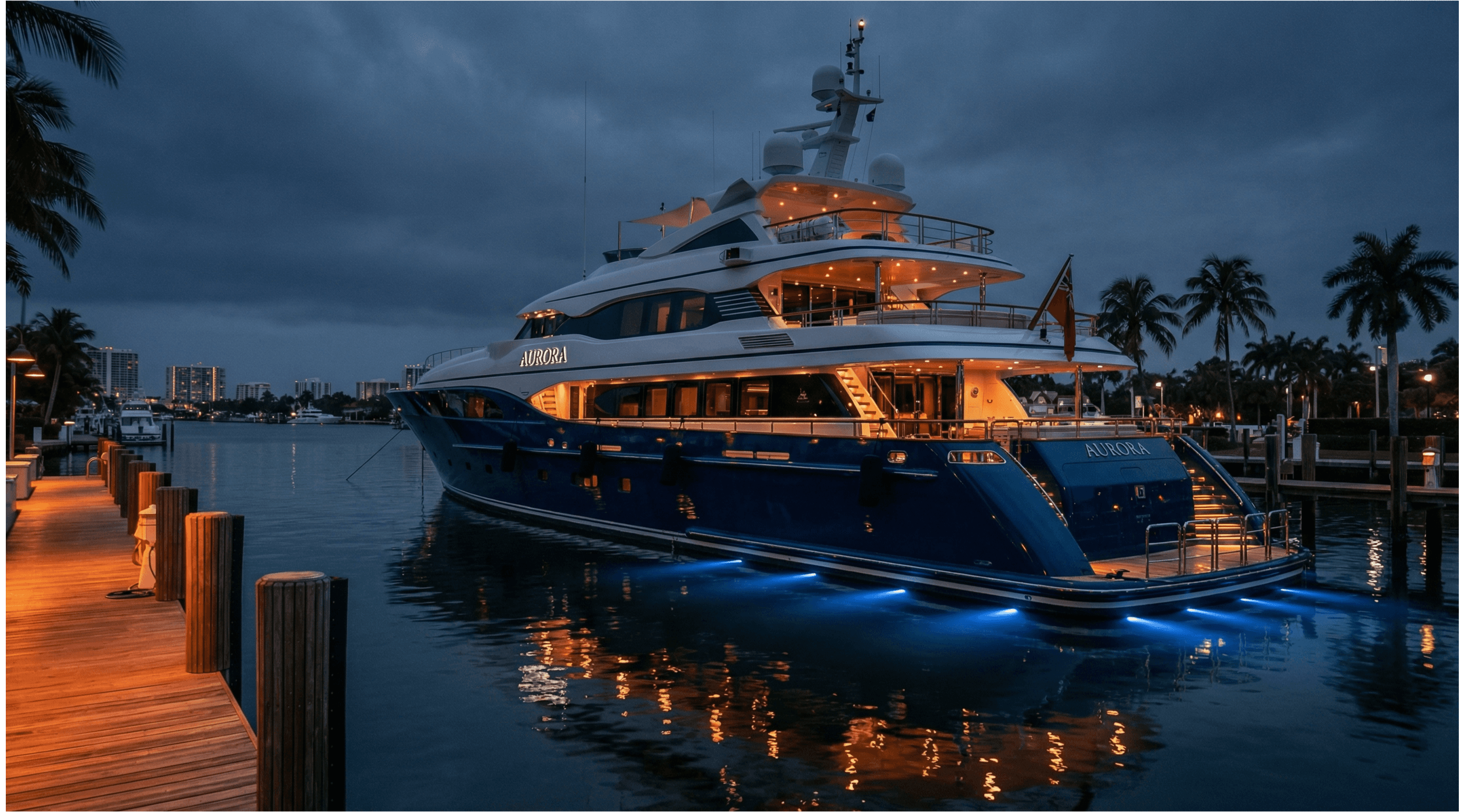 Luxury yacht with custom name lettering docked at Fort Lauderdale marina at night