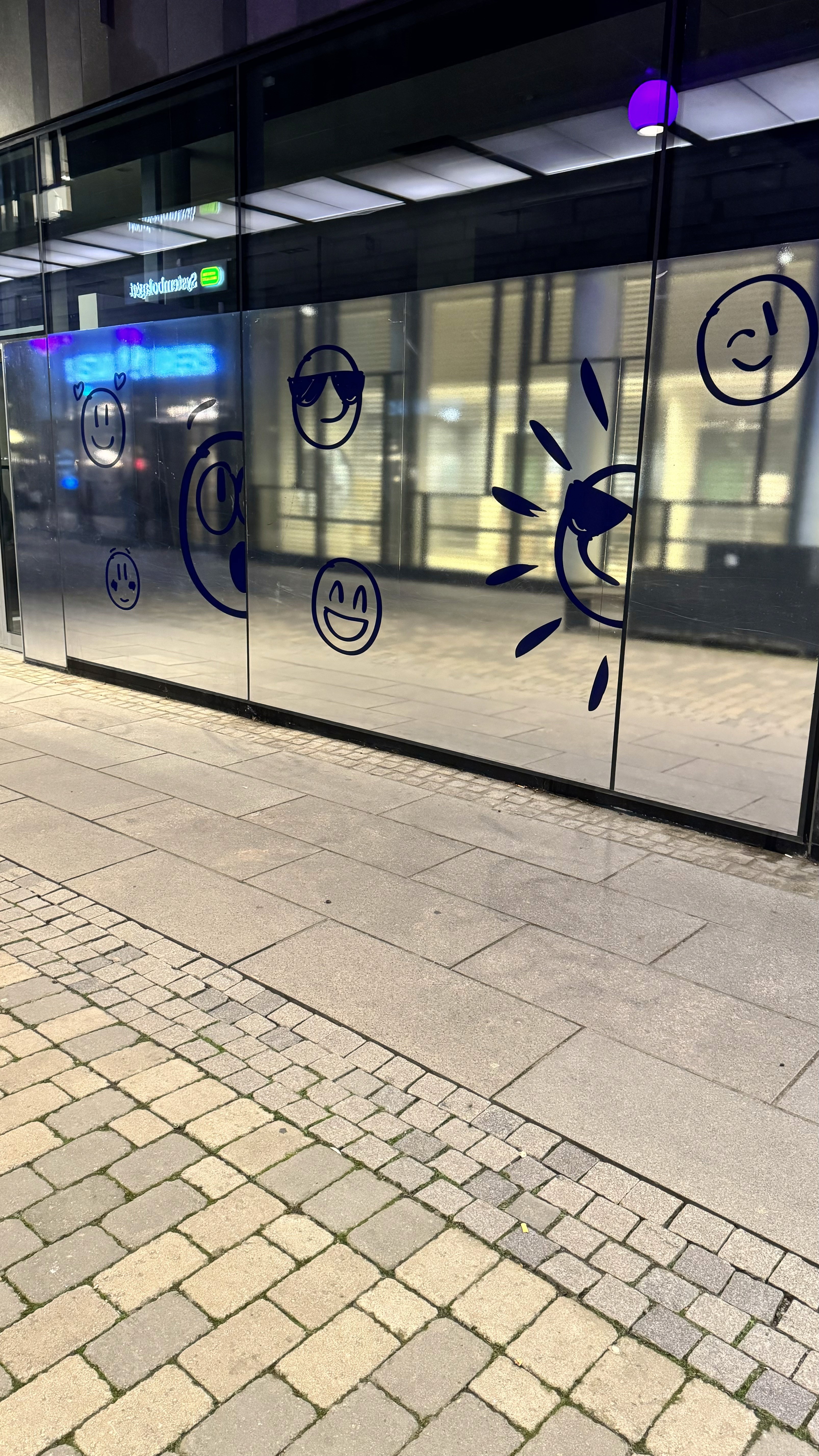 a wall with smiling emojis