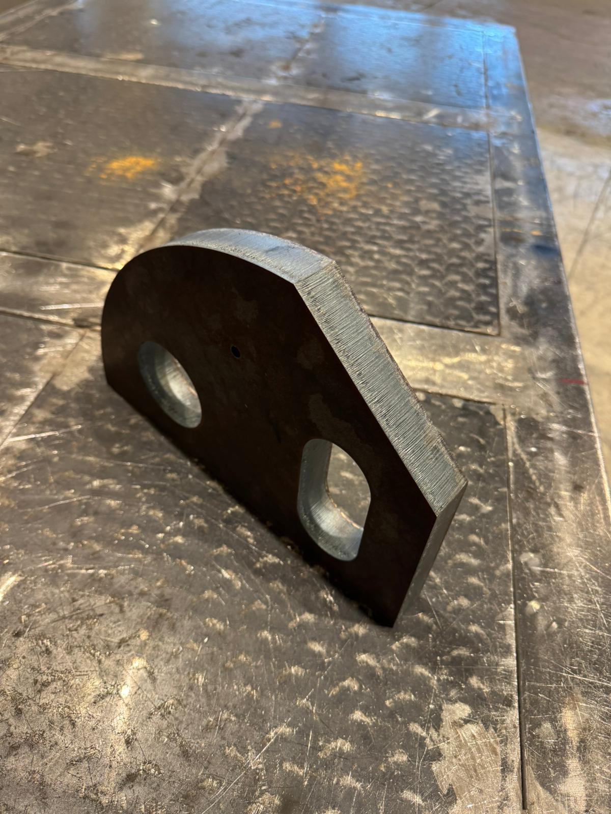 man on ladder welding post