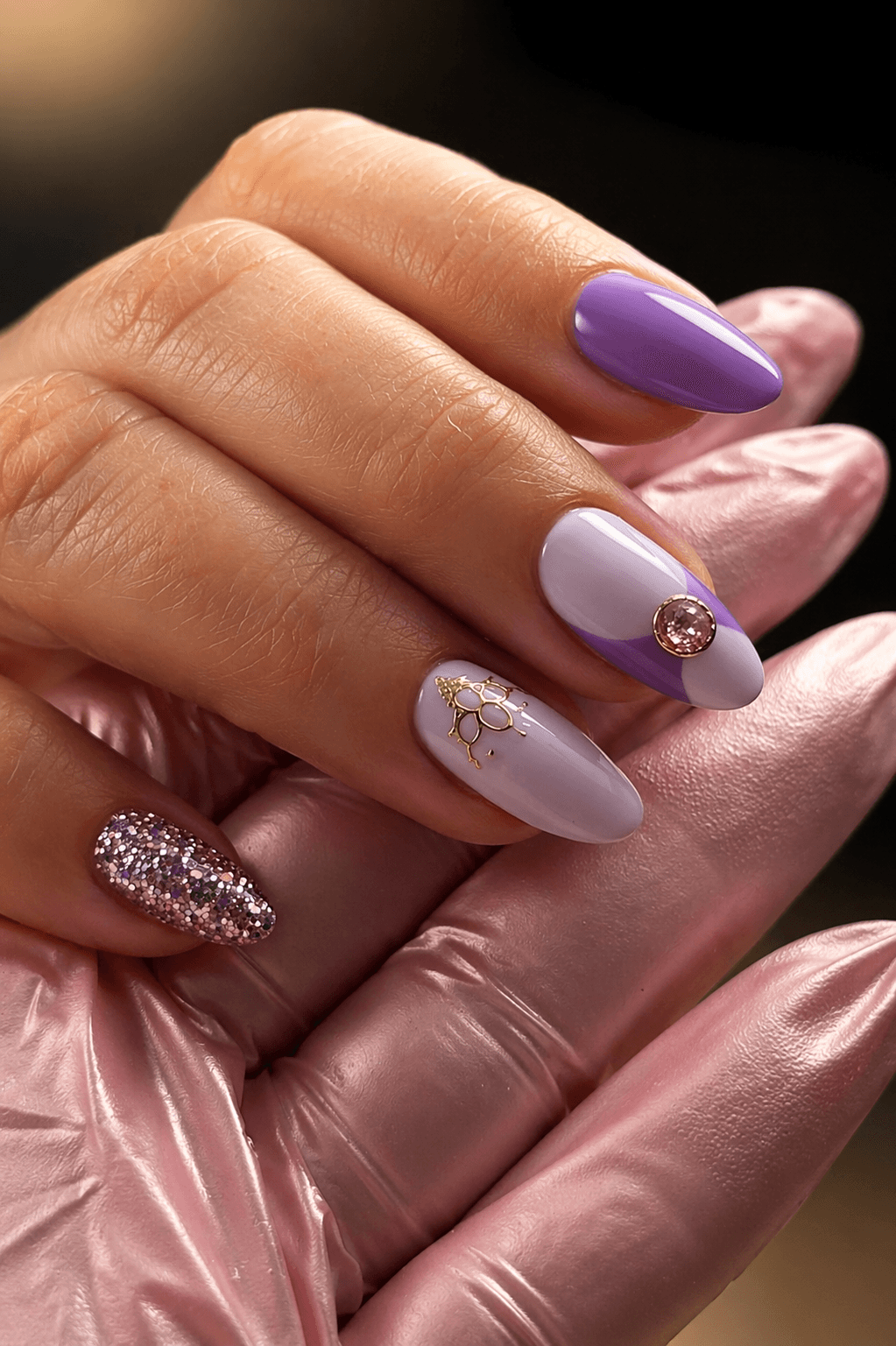 A close-up of a rustic food spread featuring a small bowl filled with mixed green and black olives on a wooden board, with a bowl of yogurt or dip and a salad in the background.