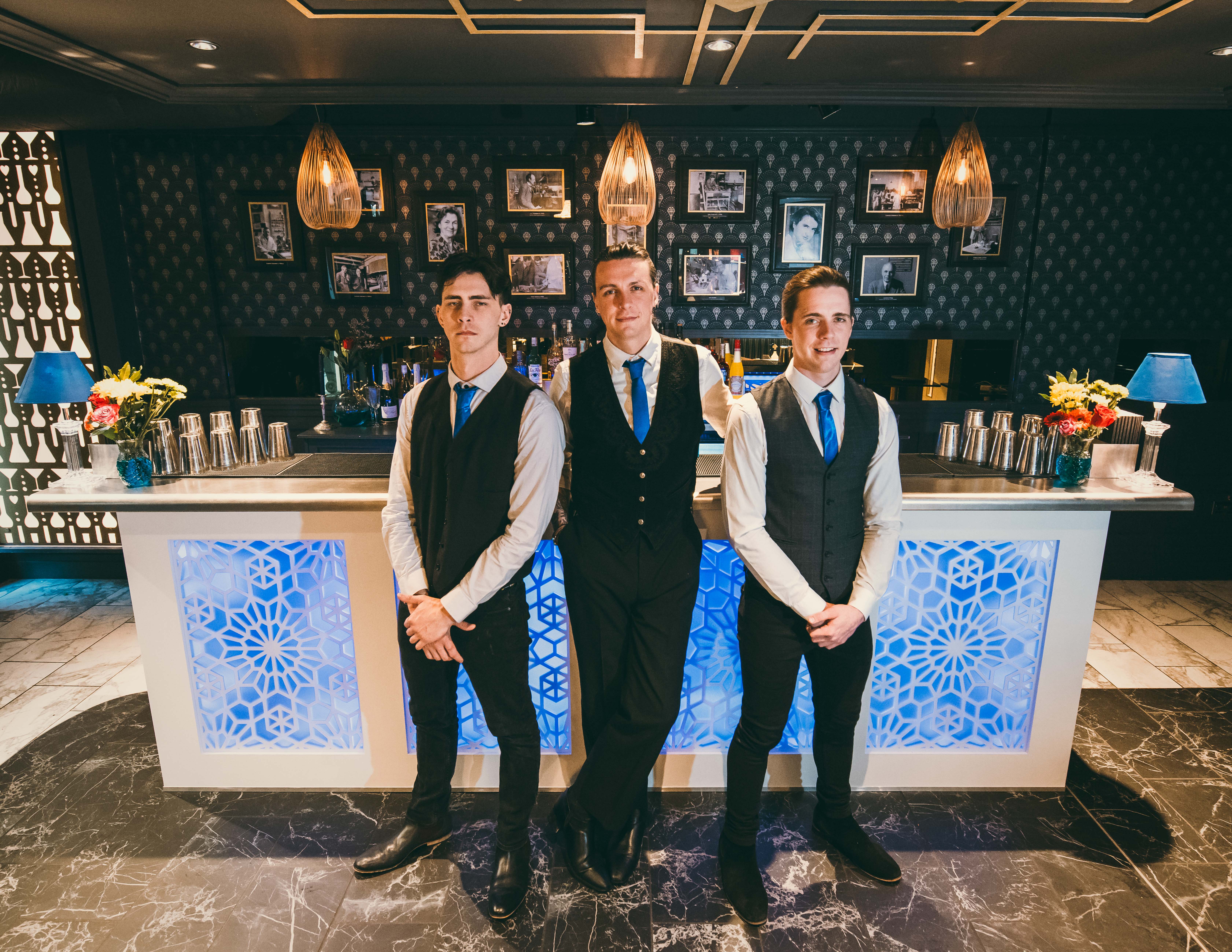 two men working on the roof of a house