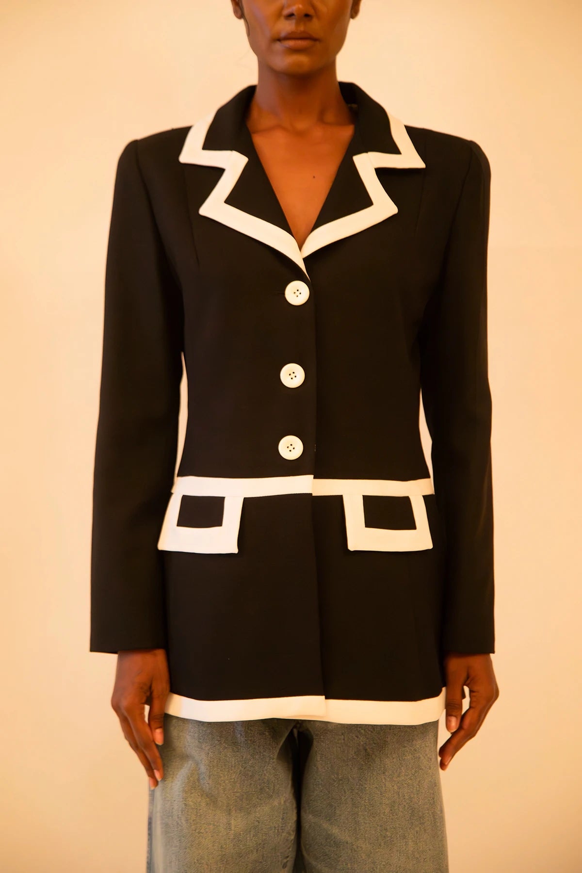 Vintage Sandro black and white fitted blazer featuring sharp tailoring and a classic silhouette, sourced from global designer archives.