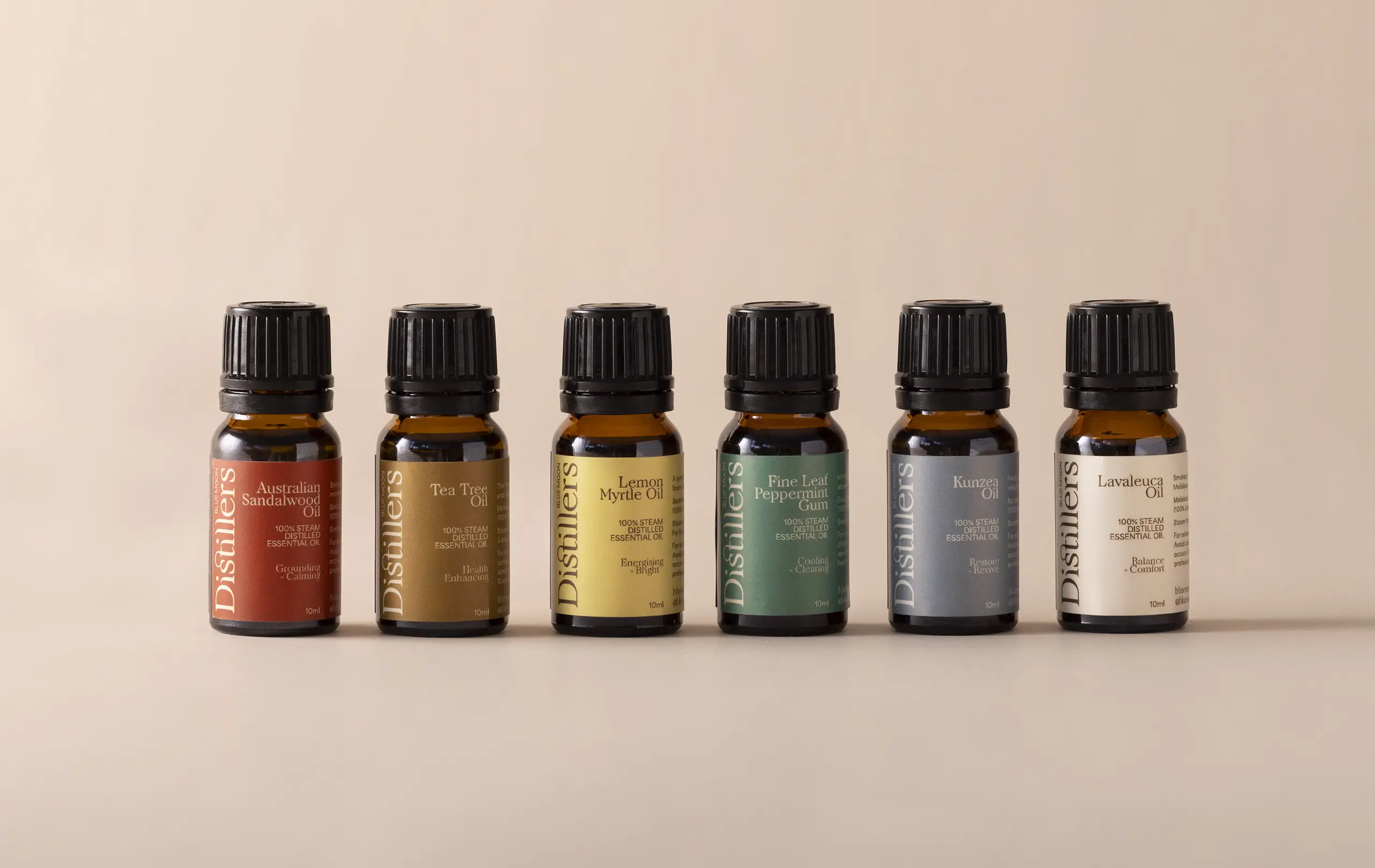 Blue Moon Distillers packaging design of essential oils displaying brand palette and typography.