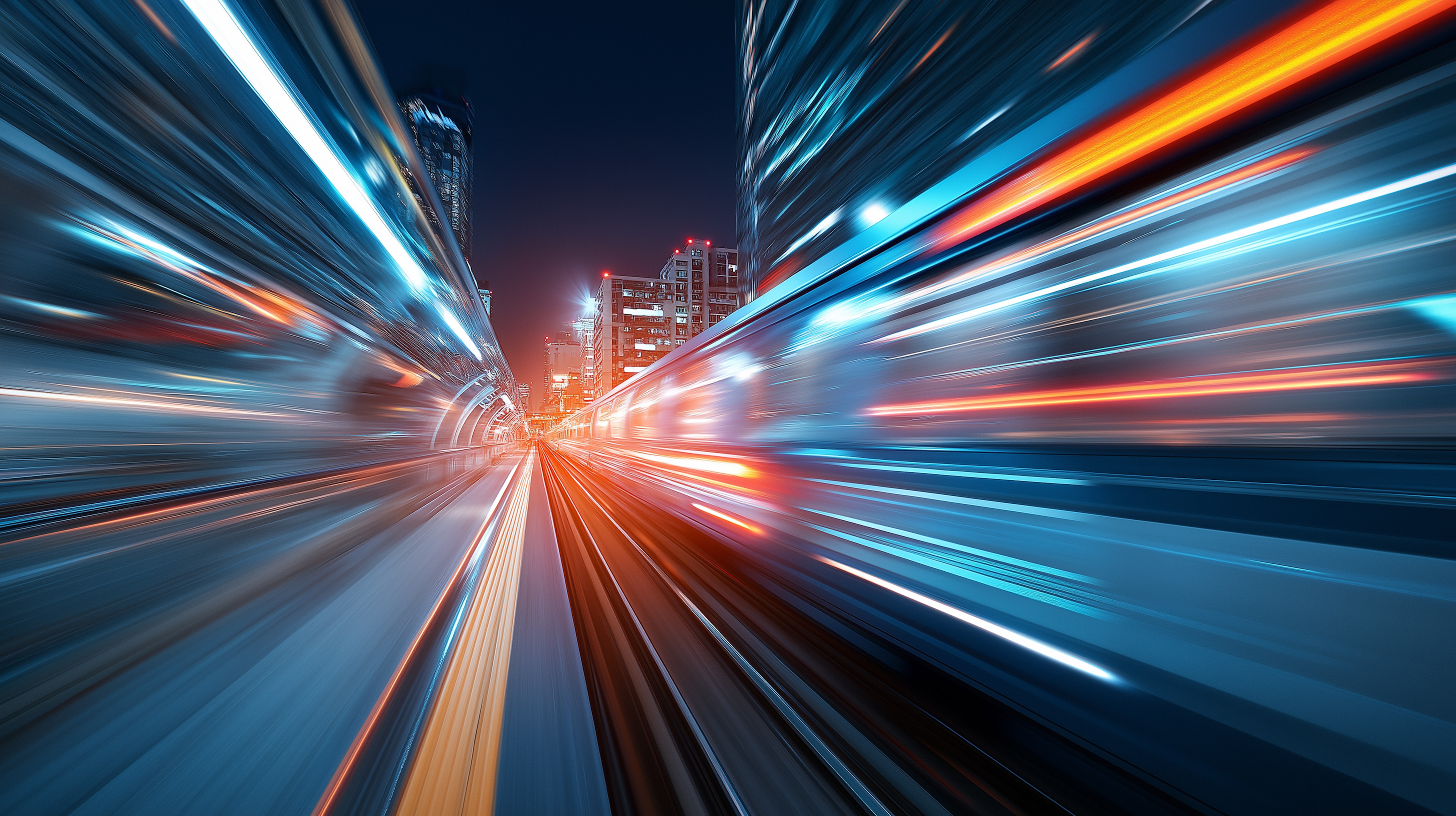 Long-exposure view of a city transit corridor with fast-moving light trails, symbolizing organisational resilience, rapid response, and continuity under dynamic conditions.