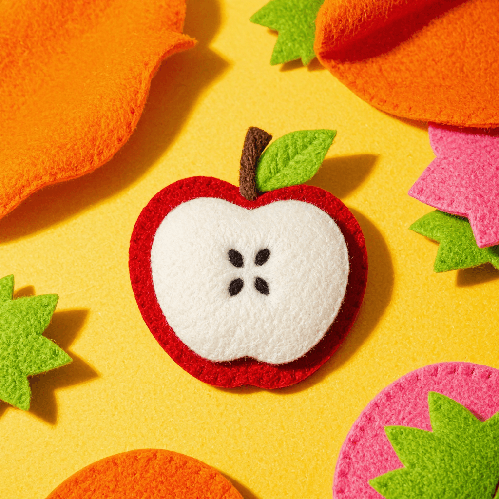 product photography of a set of felt apple shapes