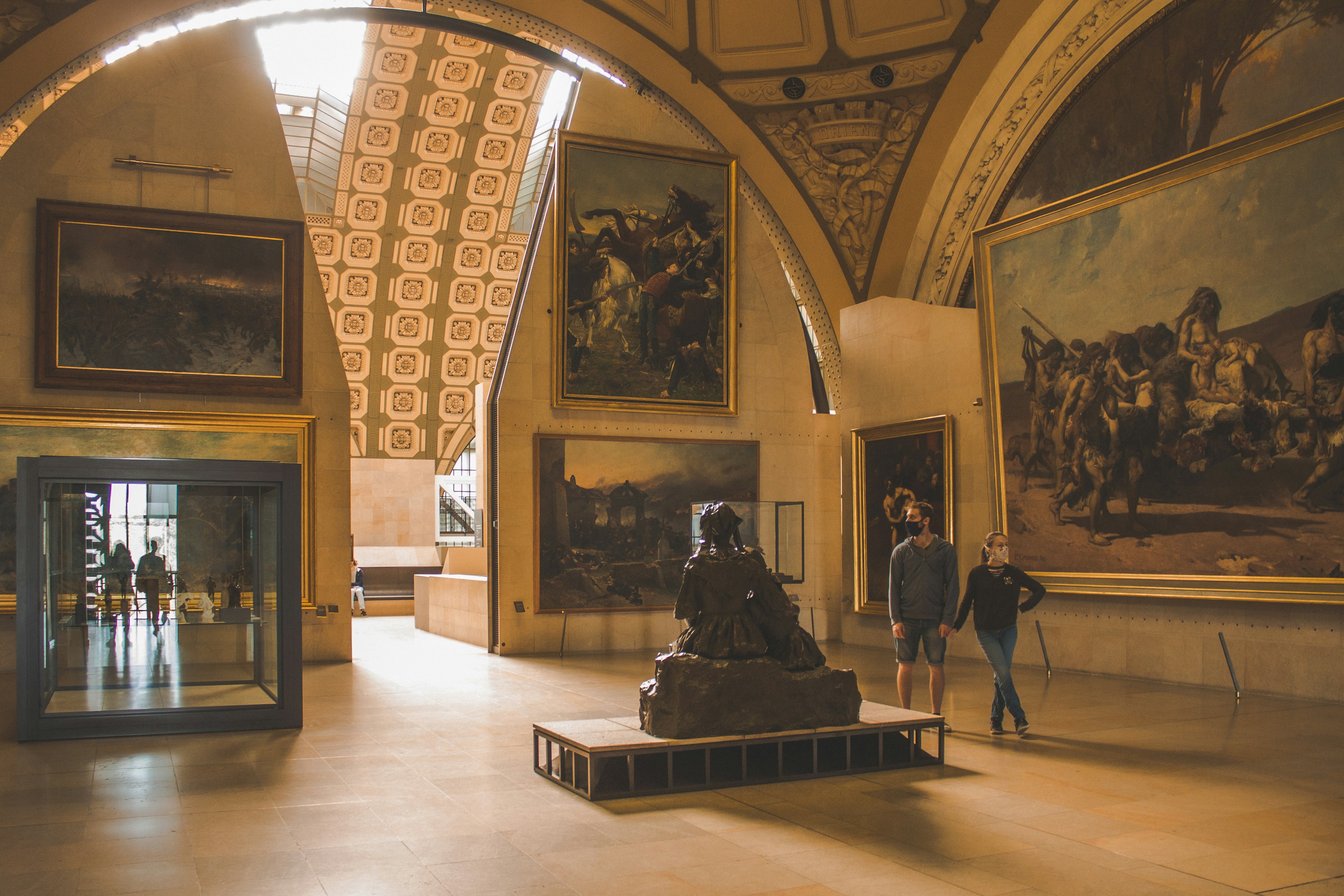 Paintings hanging in a gallery within the Musee d'Orsay