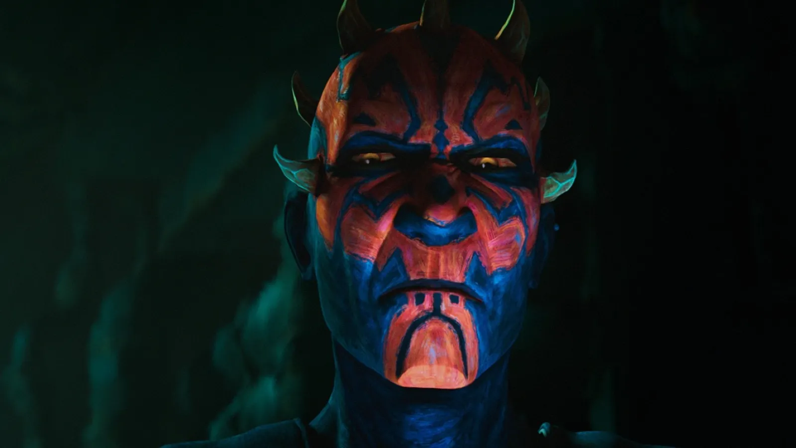 A character with striking red and black face paint, wearing small horns, stands against a shadowy background, exuding an intense and mysterious aura.
