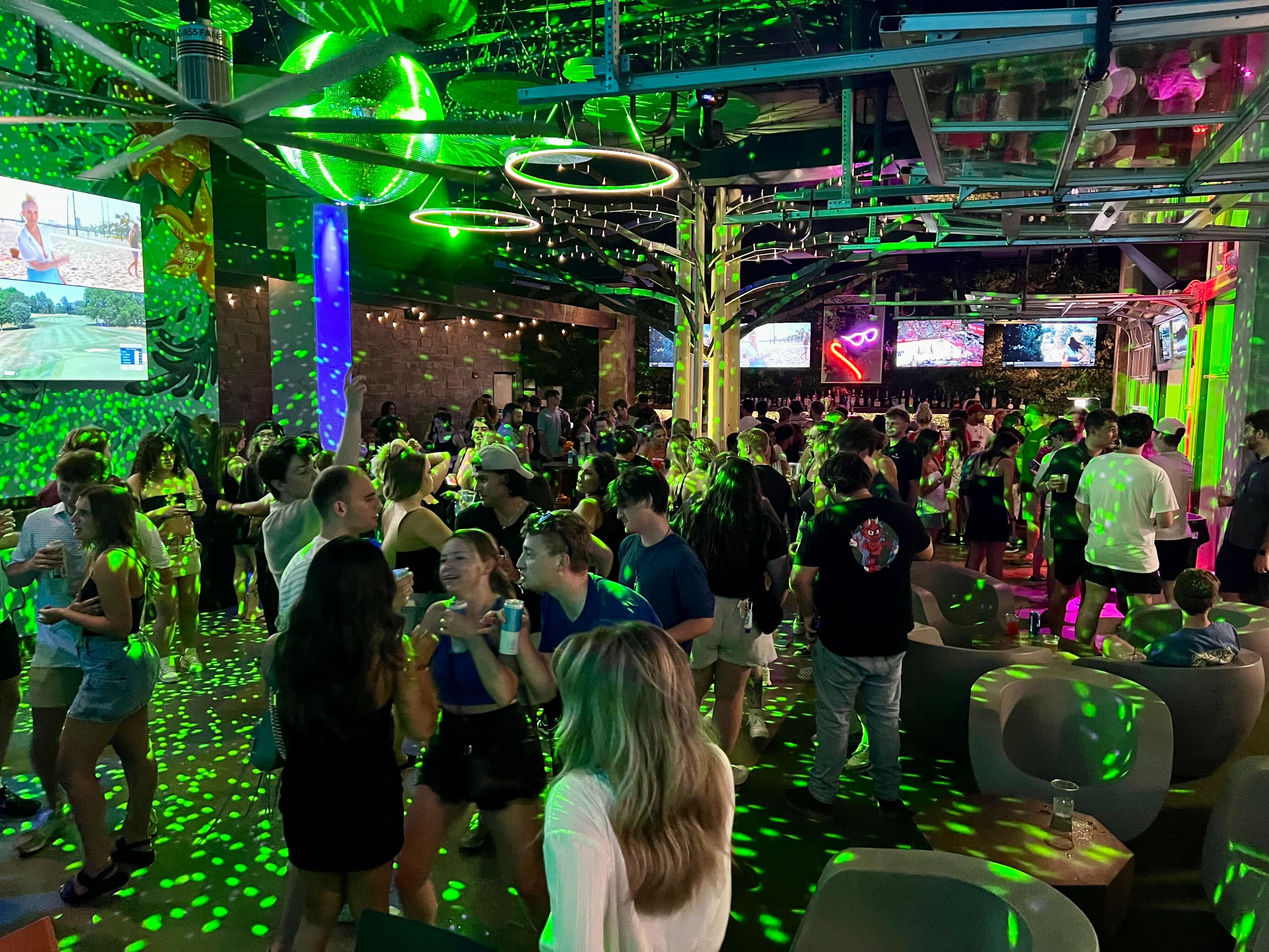 A man and a woman sitting at a bar