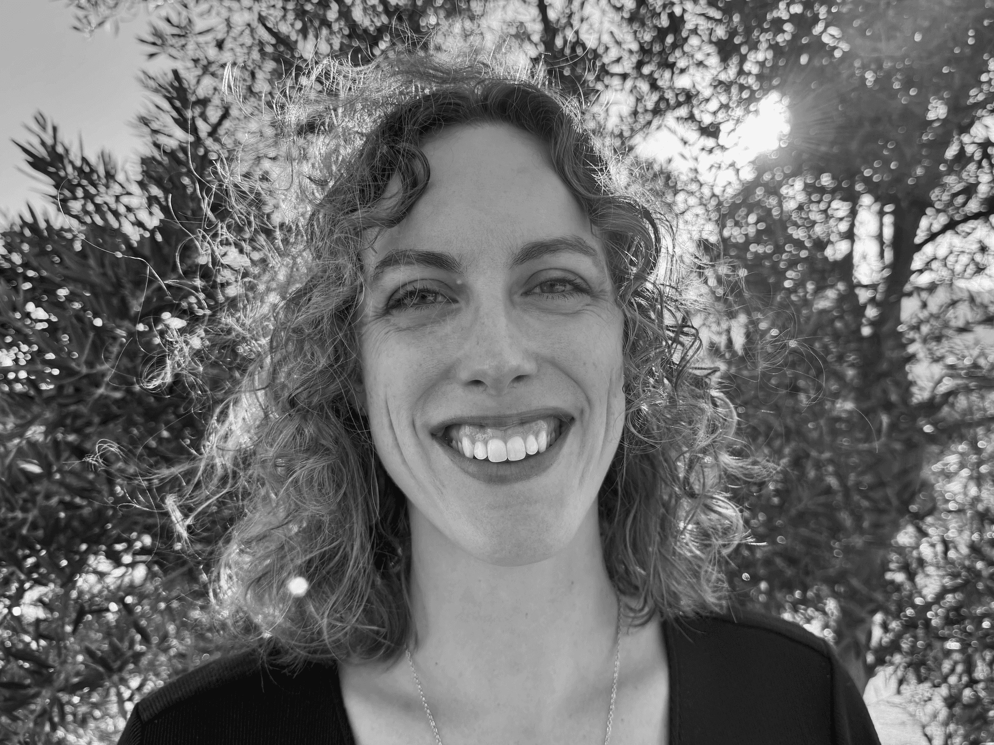 Black and white photo of Charlotte Passot smiling