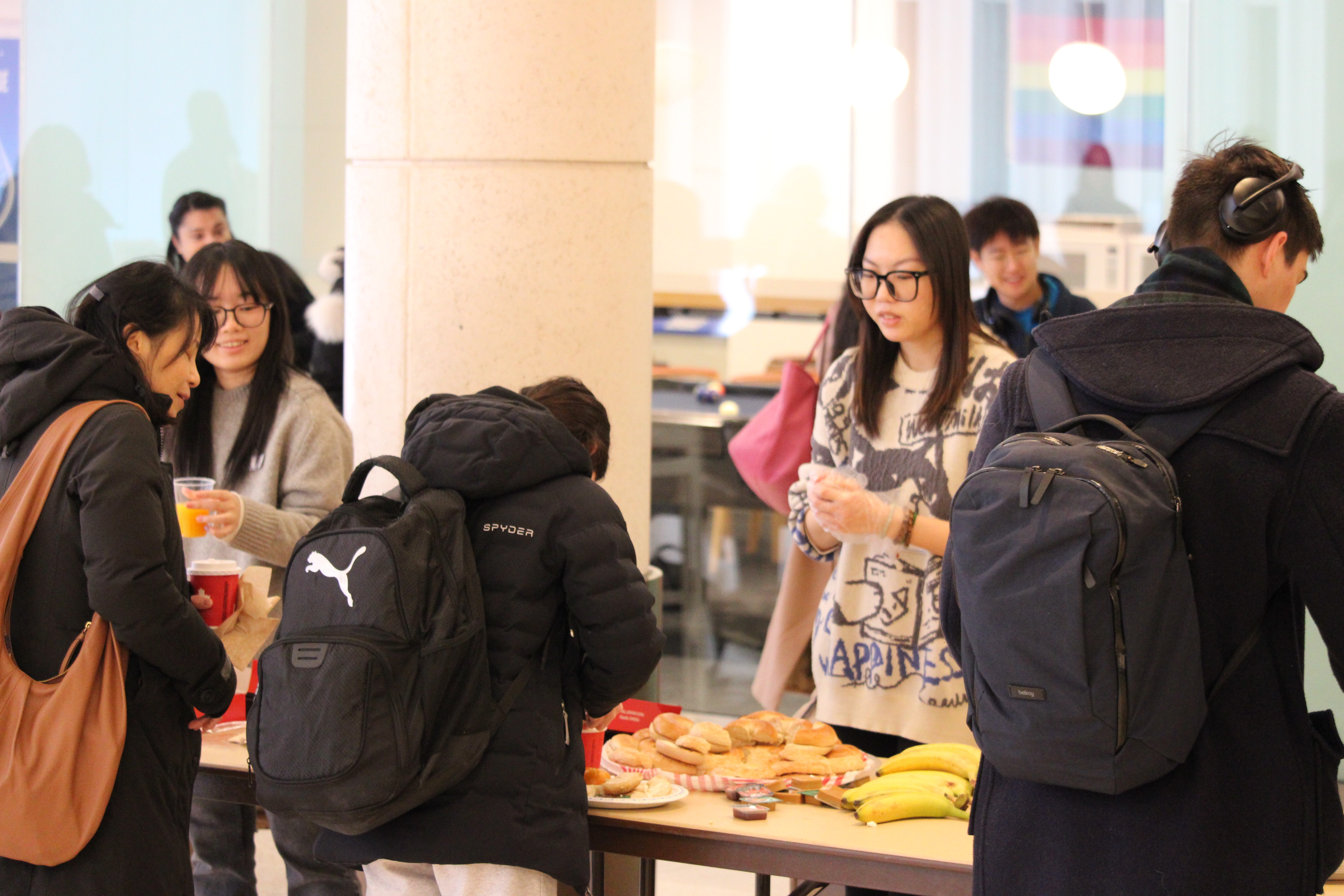 A person stands in a sandstone cave.
