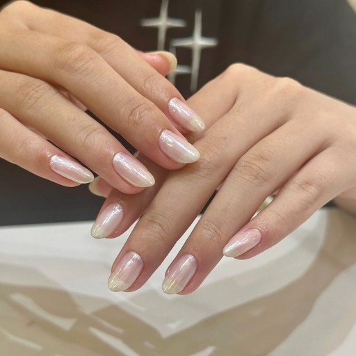 selective focus photography of woman's pink manicure