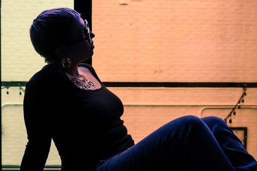 Music producer sitting on a chair in his studio
