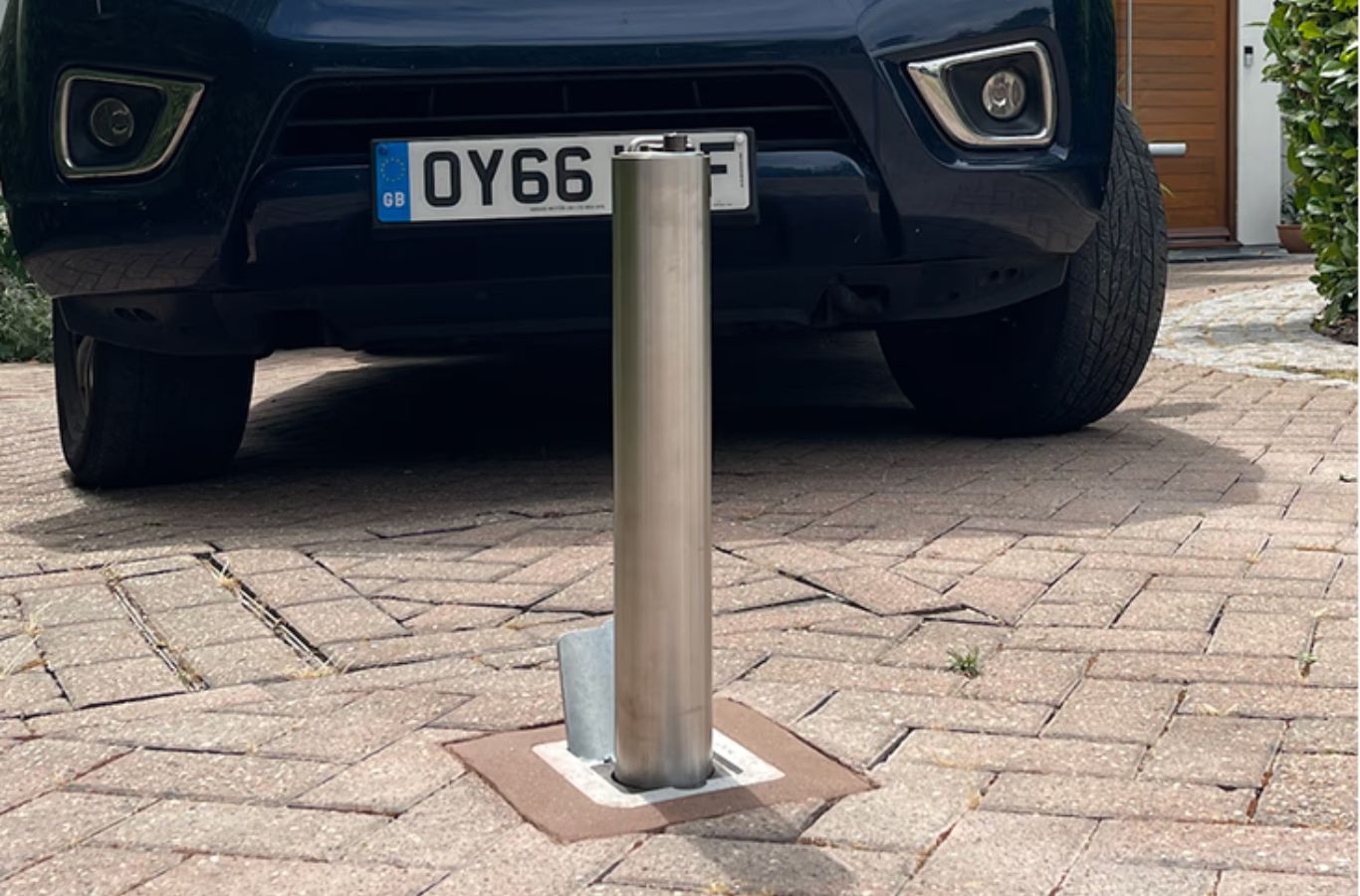 Wentworth Protection Limited team member installing driveway bollards, highlighting durability and reliable property protection