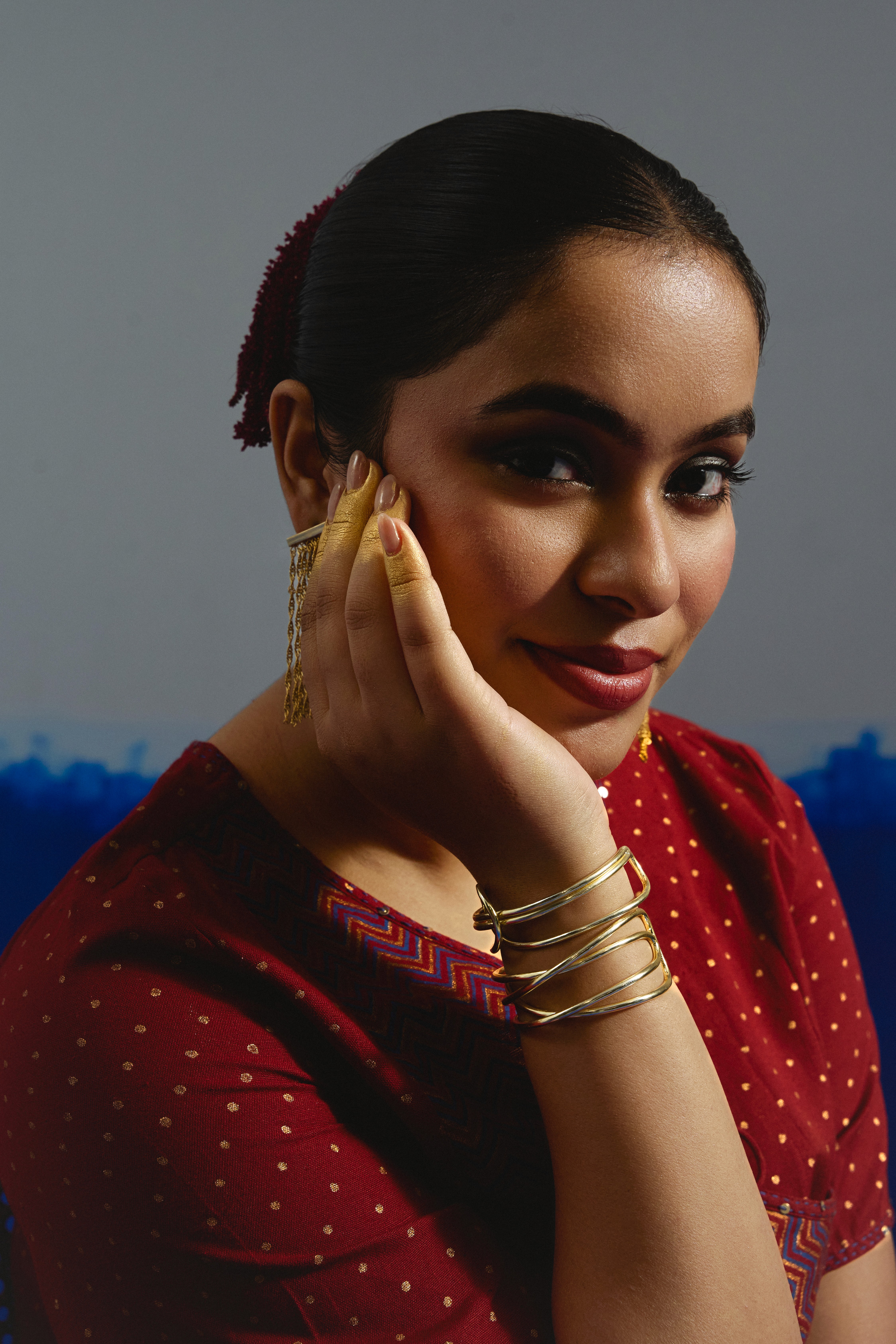 Group of friends smiling on a lively city street at night