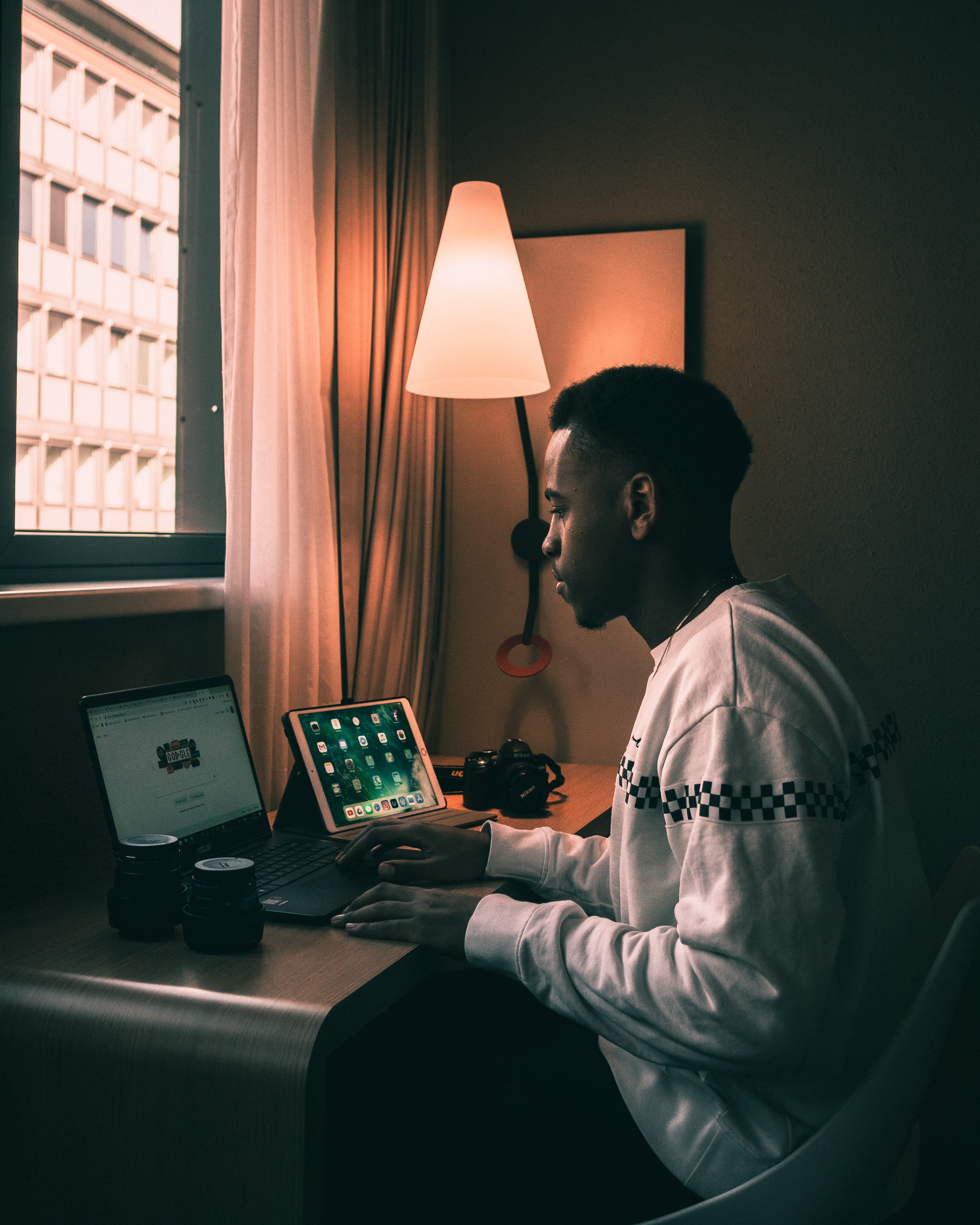 A man working behind a laptop.