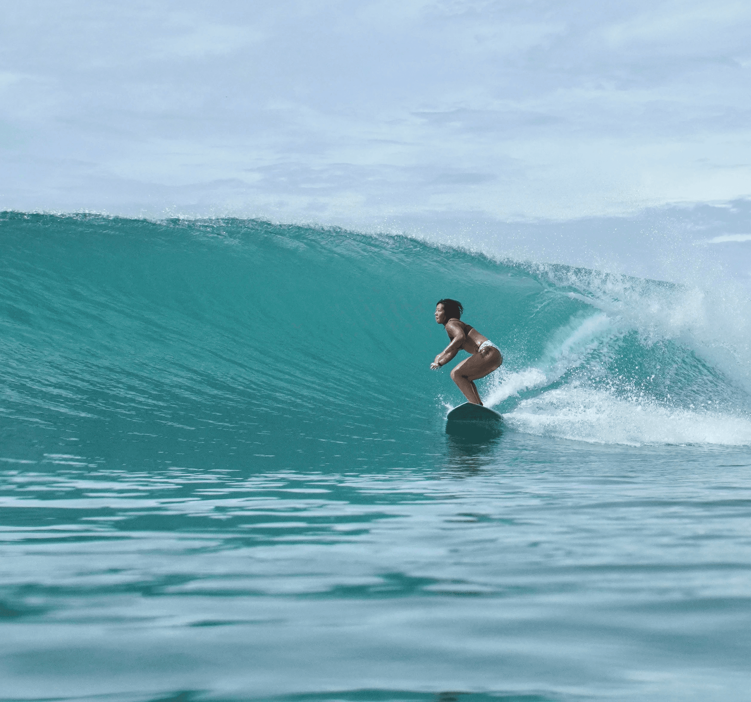 A kid practicing surfing