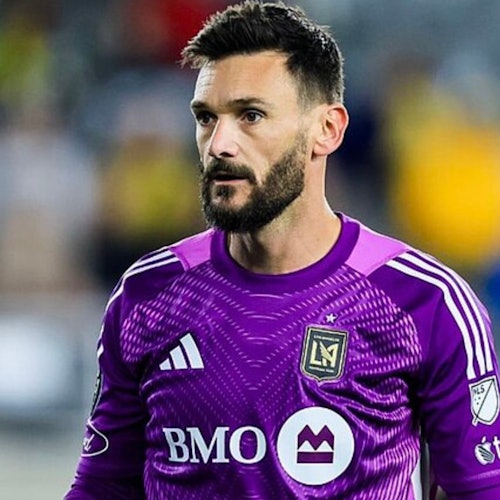 A soccer player in a purple jersey with "LAFC" and "BMO" logos stands on the field, looking forward.