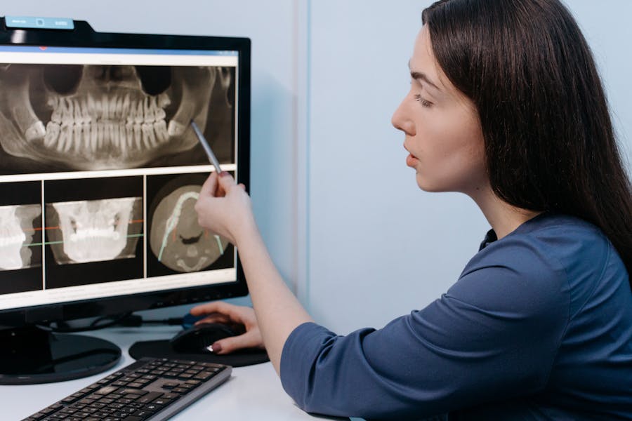 a dentist shows xray scans