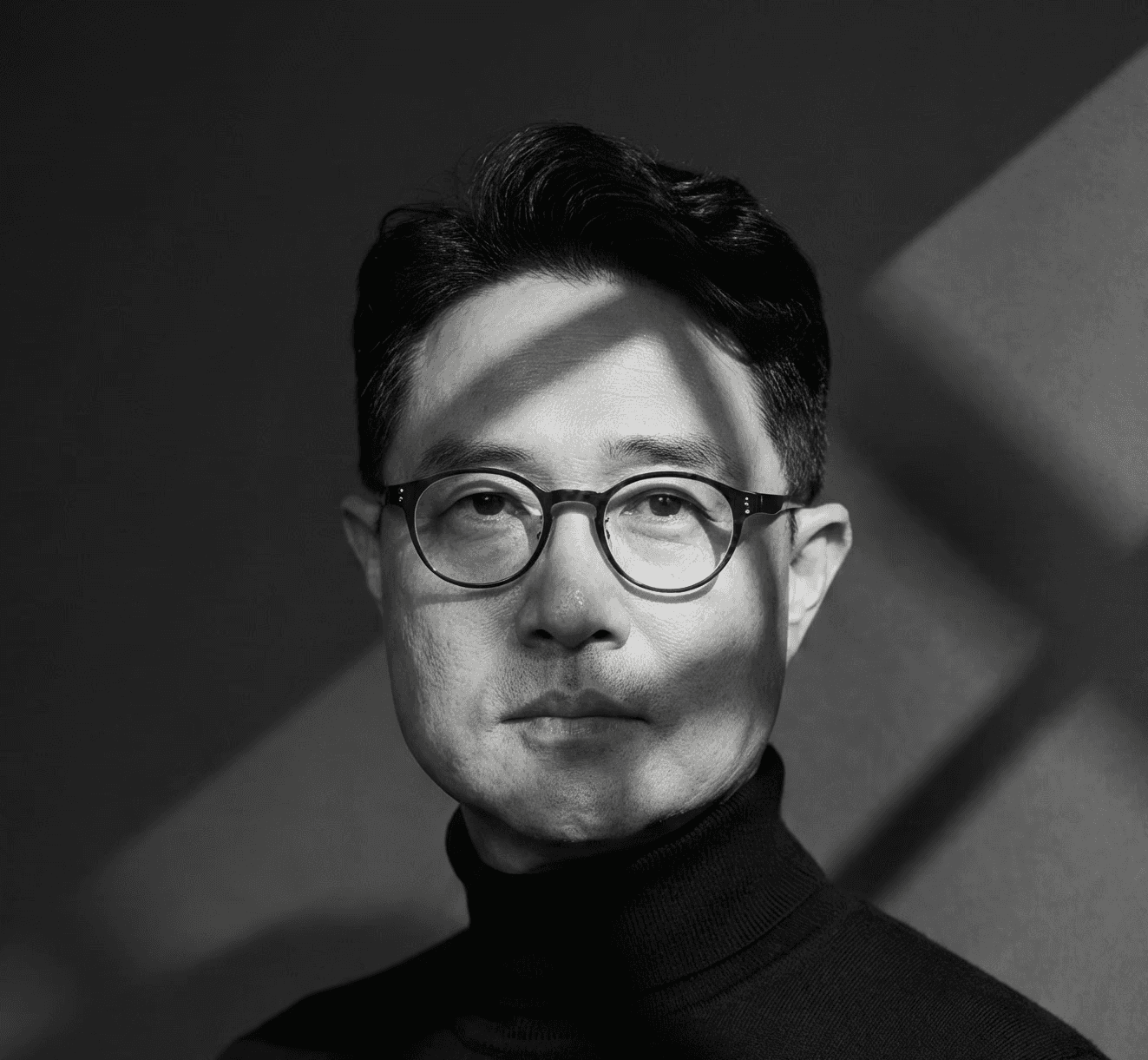 Portrait of founder smiling with yellow background