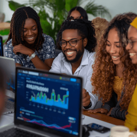 Two smiling people outdoors, one in a pink jacket holding a white phone, the other in blue with a buzz cut holding a blue phone, under a clear sky.