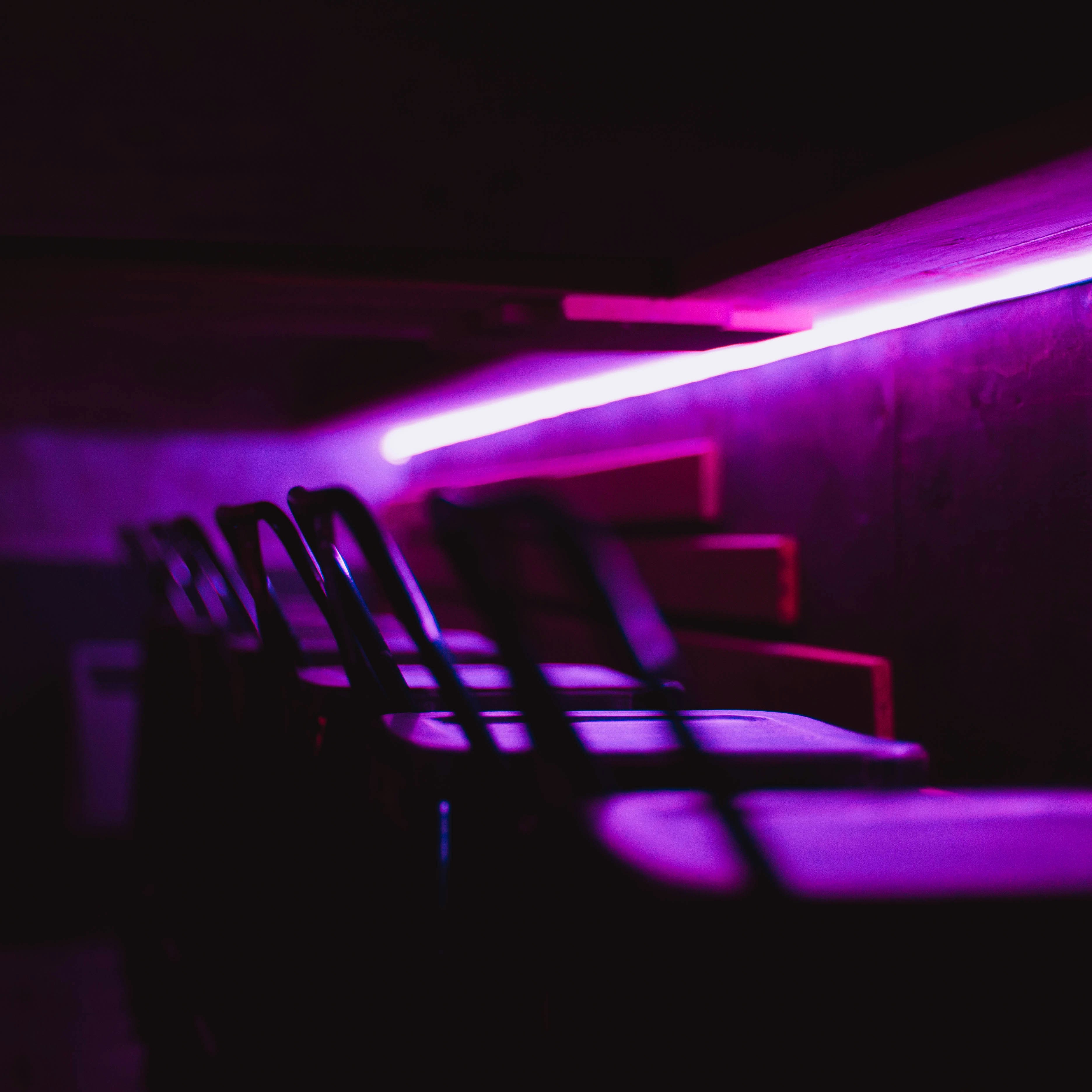 woman holding clear glass cup with blue liquid