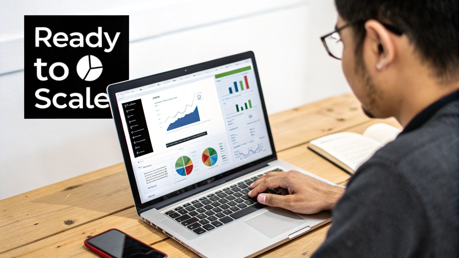 A man analyzing data dashboards on a laptop, with a 