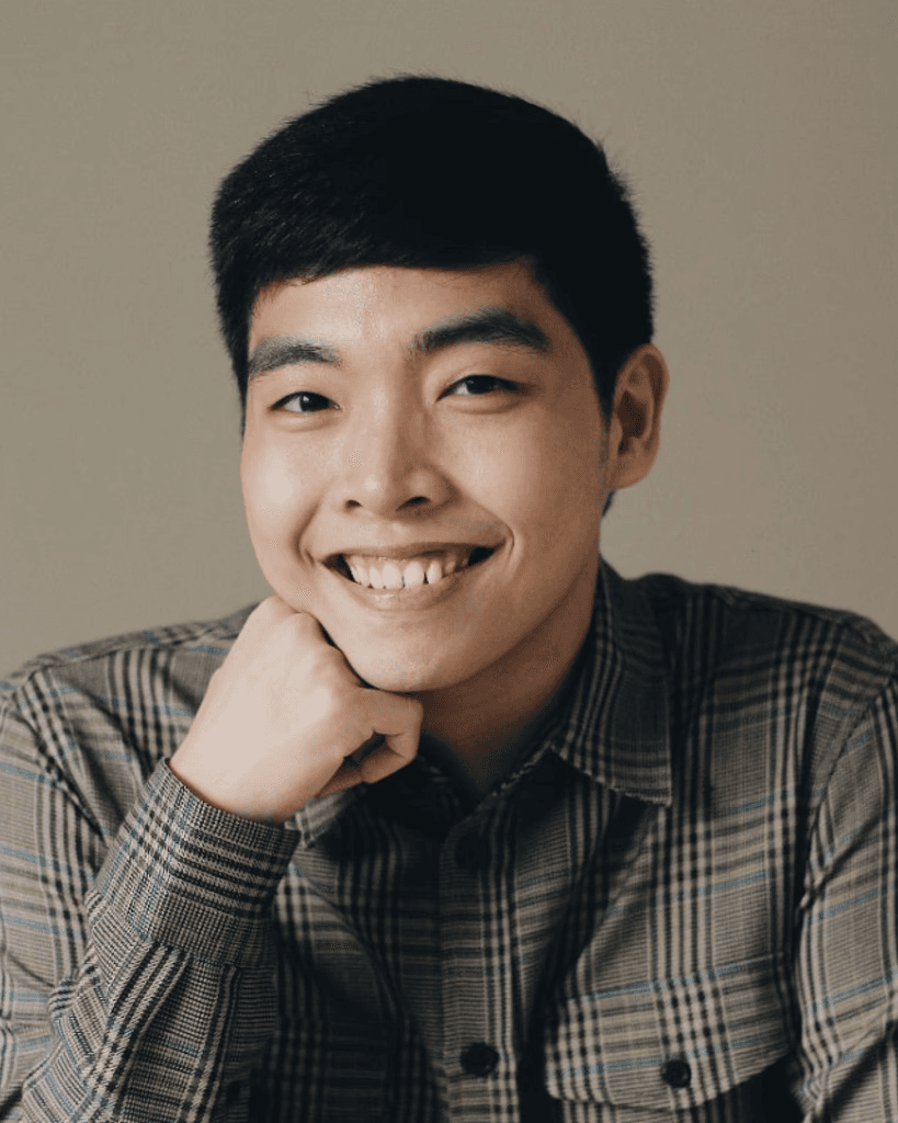 Filipino against a plain beige background