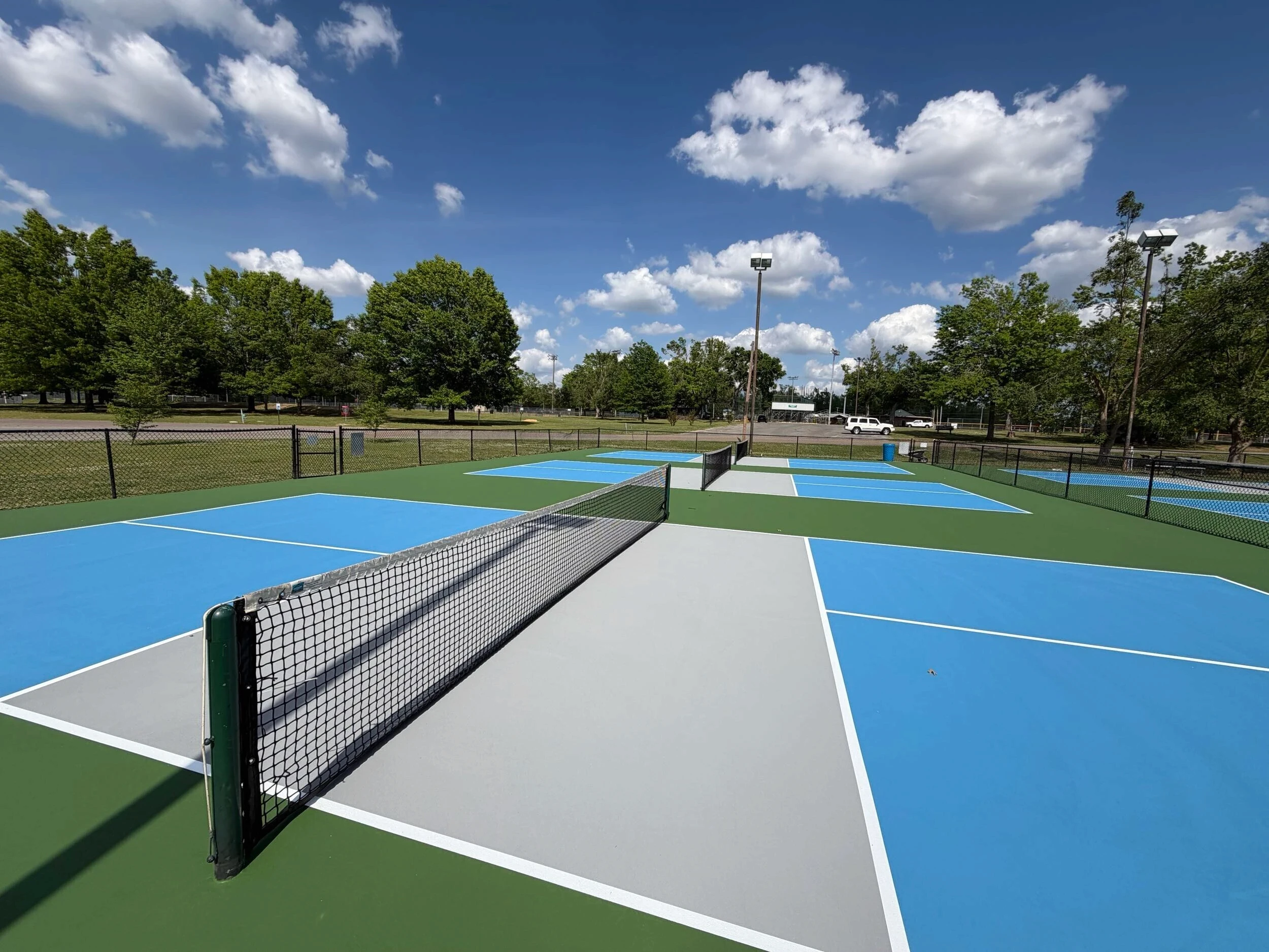 Newly resurfaced pickleball courts with fresh striping and net systems at Corinth Parks & Rec