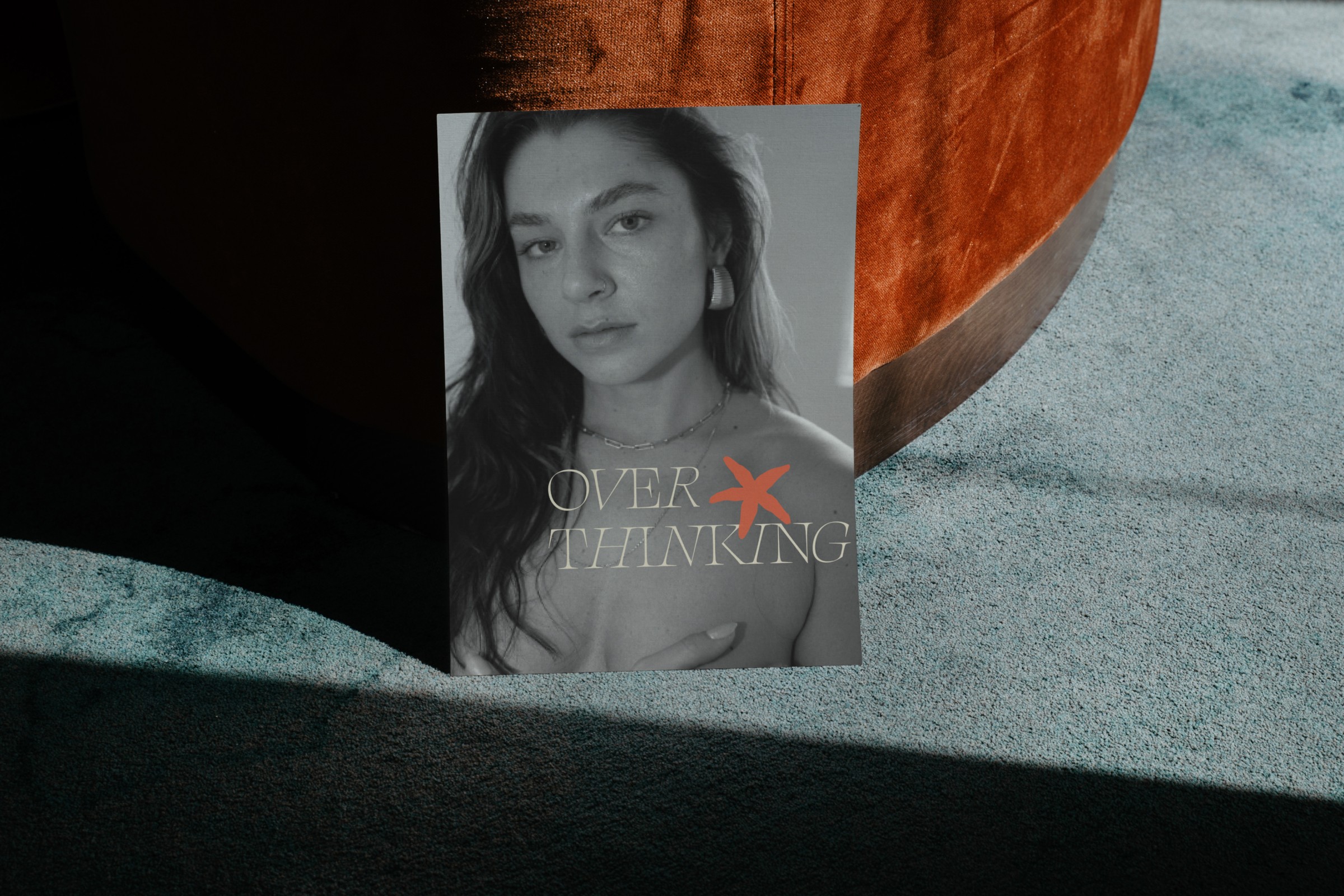 Editorial-style print with a black-and-white portrait, highlighting the studio’s bold typography and artful storytelling.