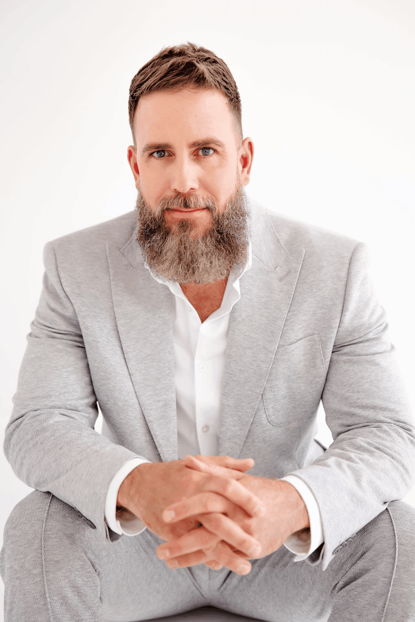 a table and chairs in a room with a view of a city