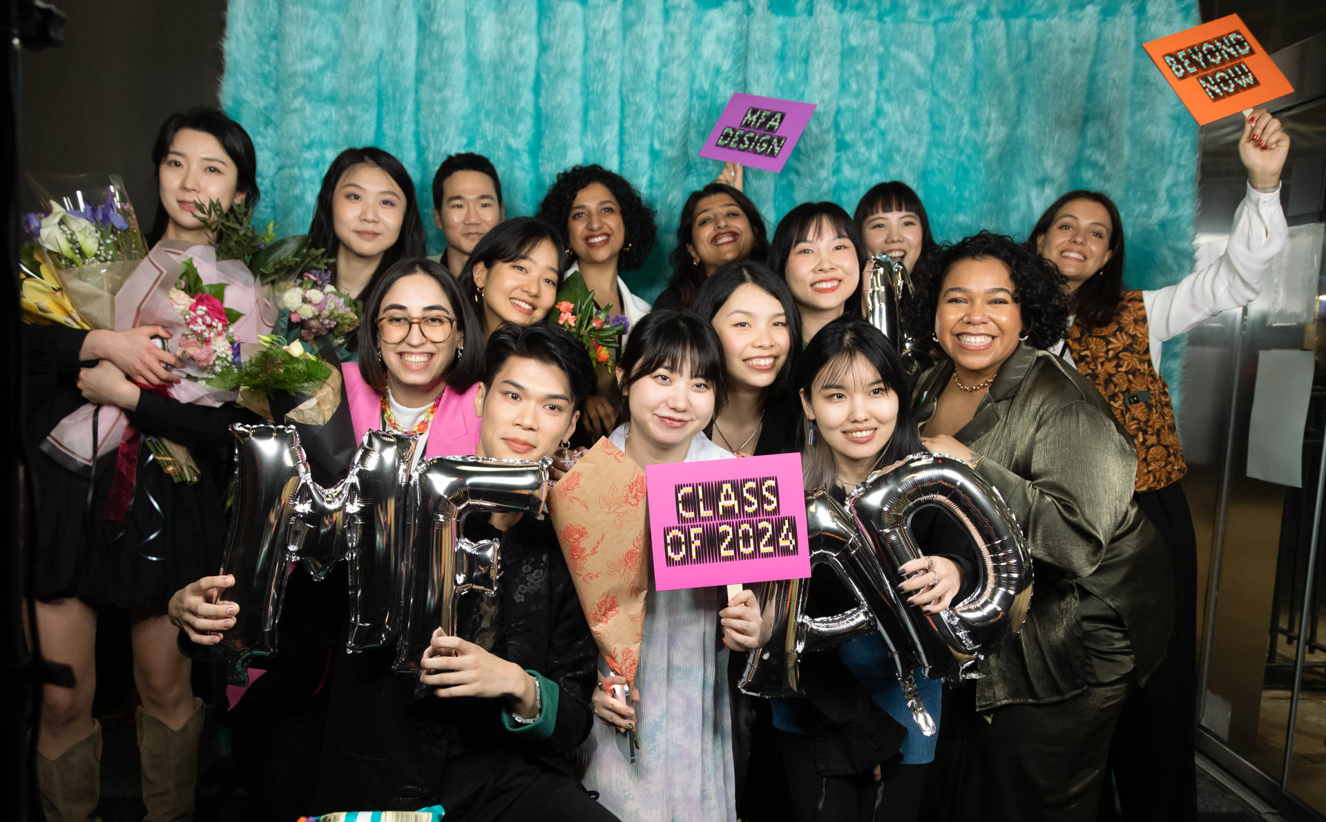 a group of students smiling for the camera in the SVA Theatre lobby after the Venture Forum