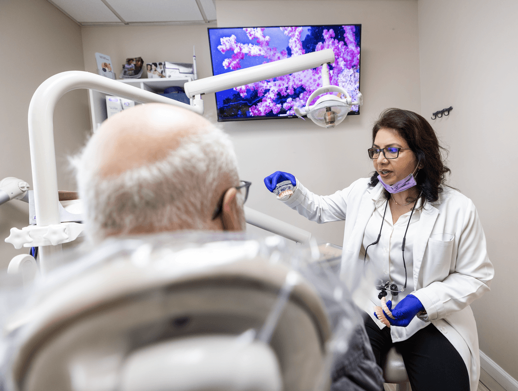 Dr. Navneet Rai discussing Dental Implants with Patient in Newark & Milltown NJ