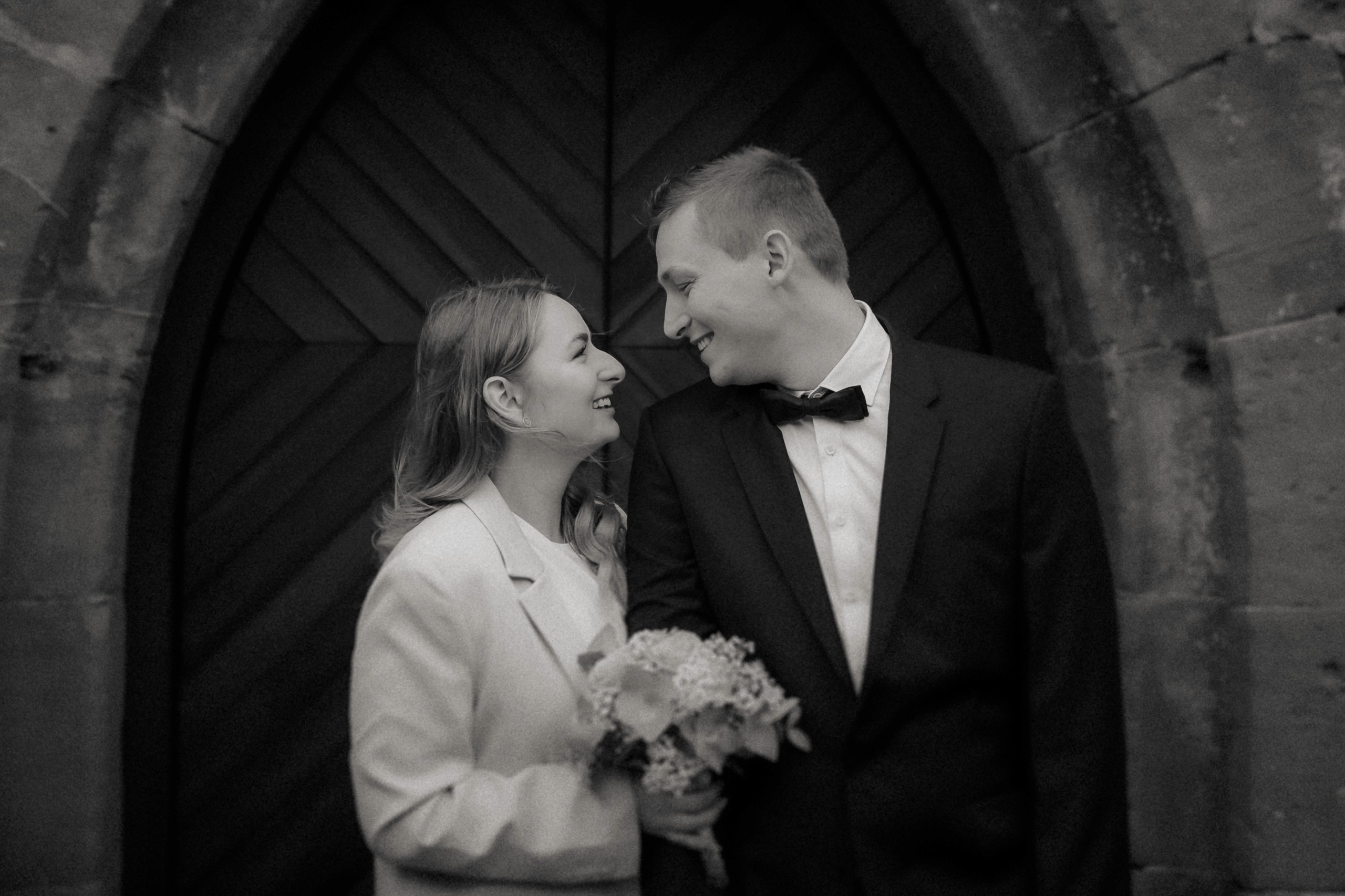 a woman holding a red flower