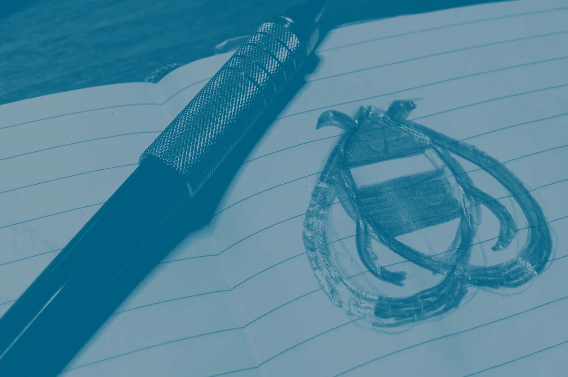 A pen rests on an open notebook displaying a hand-drawn, lined insect design, showcasing artistic creativity and inspiration. Rob Harrigan Design. Rob Harrigan. 