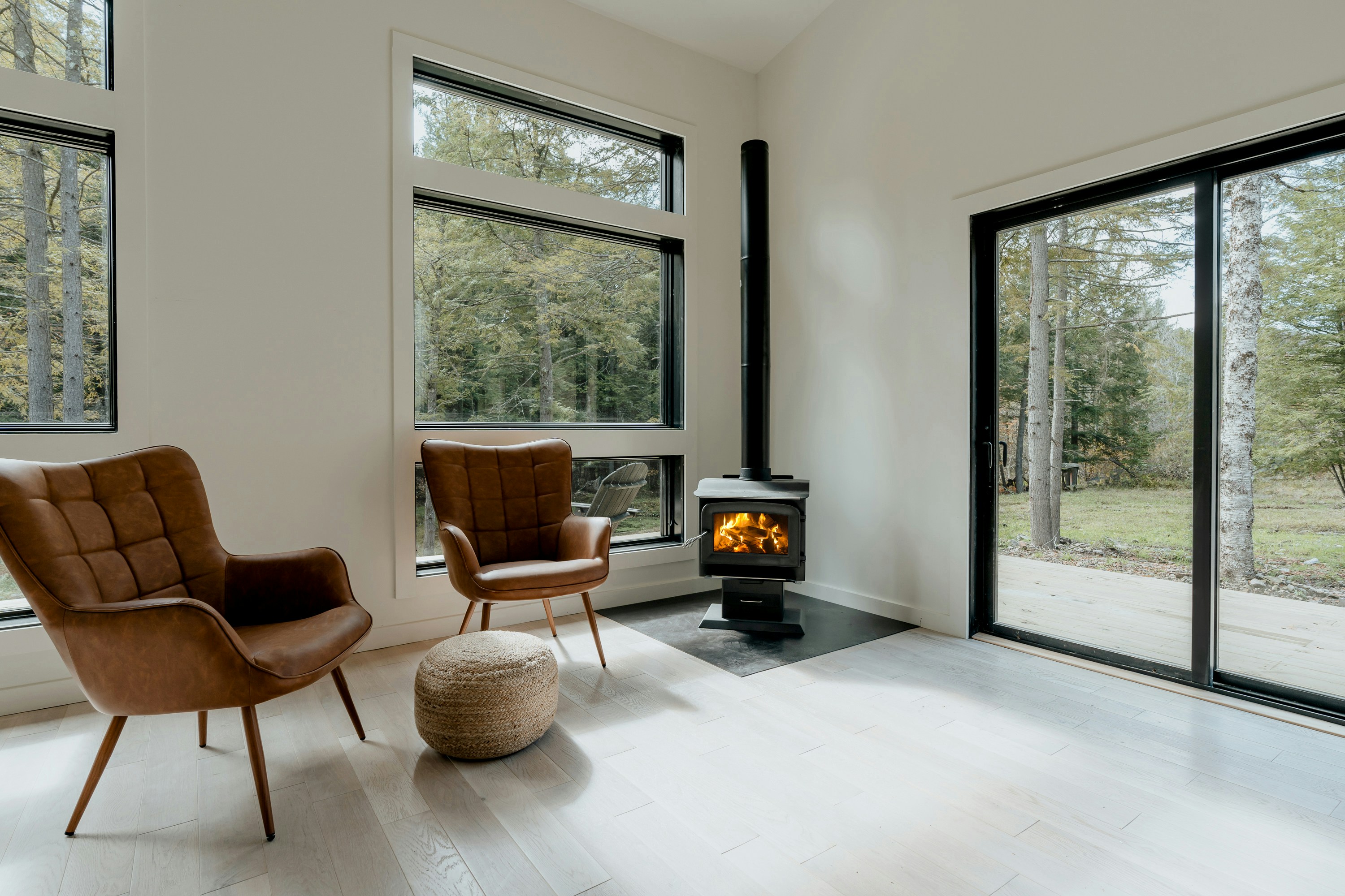 Modern room with chairs and wood stove