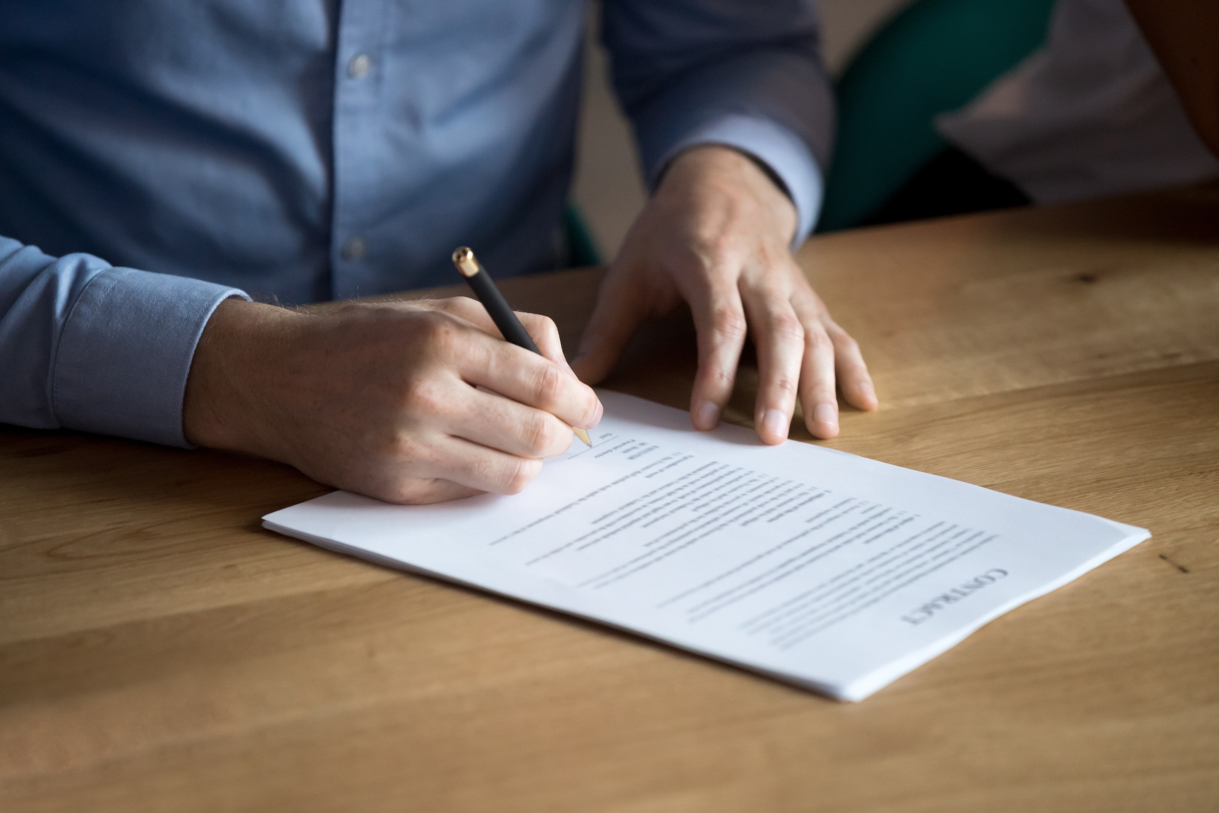 Business man manager customer hand sign contract, male client put written signature on legal paper subscribe document fill form make sale purchase commercial insurance deal agreement, close up view