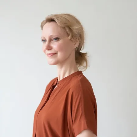 Woman in terracotta blouse presenting discovery call thank-you message AI prompt for menopause coaches