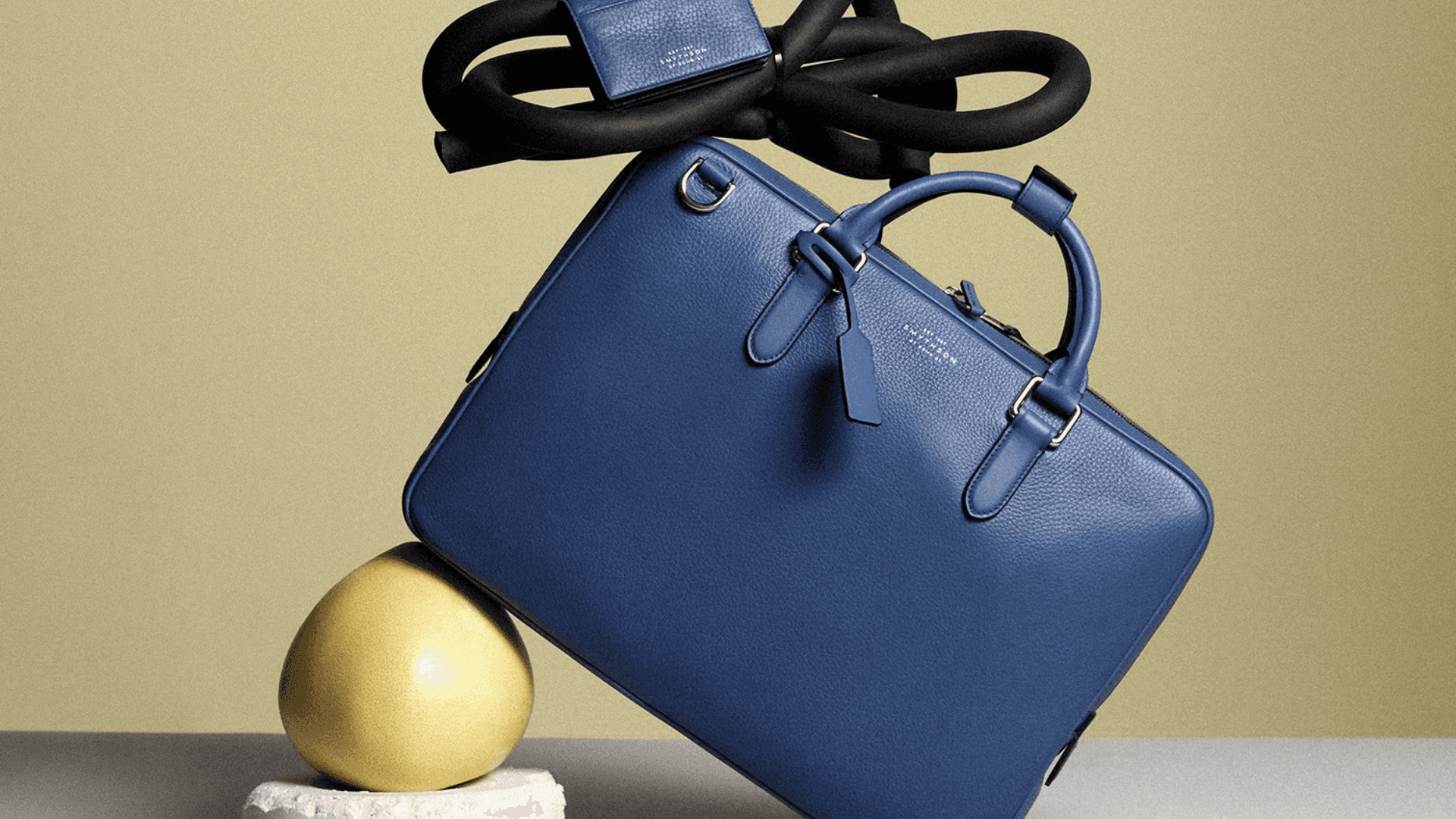 A styled shot of a Smythson handbag