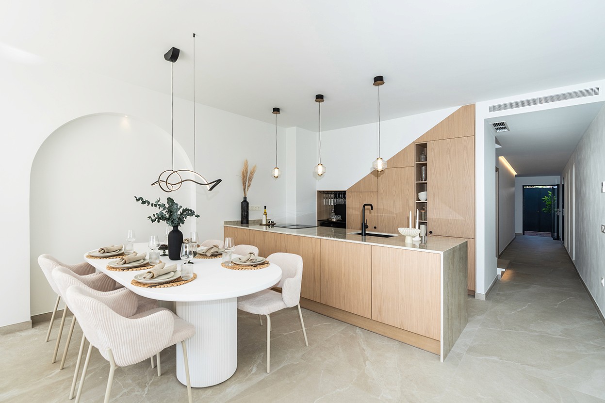 High-end, semi-open kitchen with a central island and Bosch appliances in the 'Casa Preciosa' townhouse.
