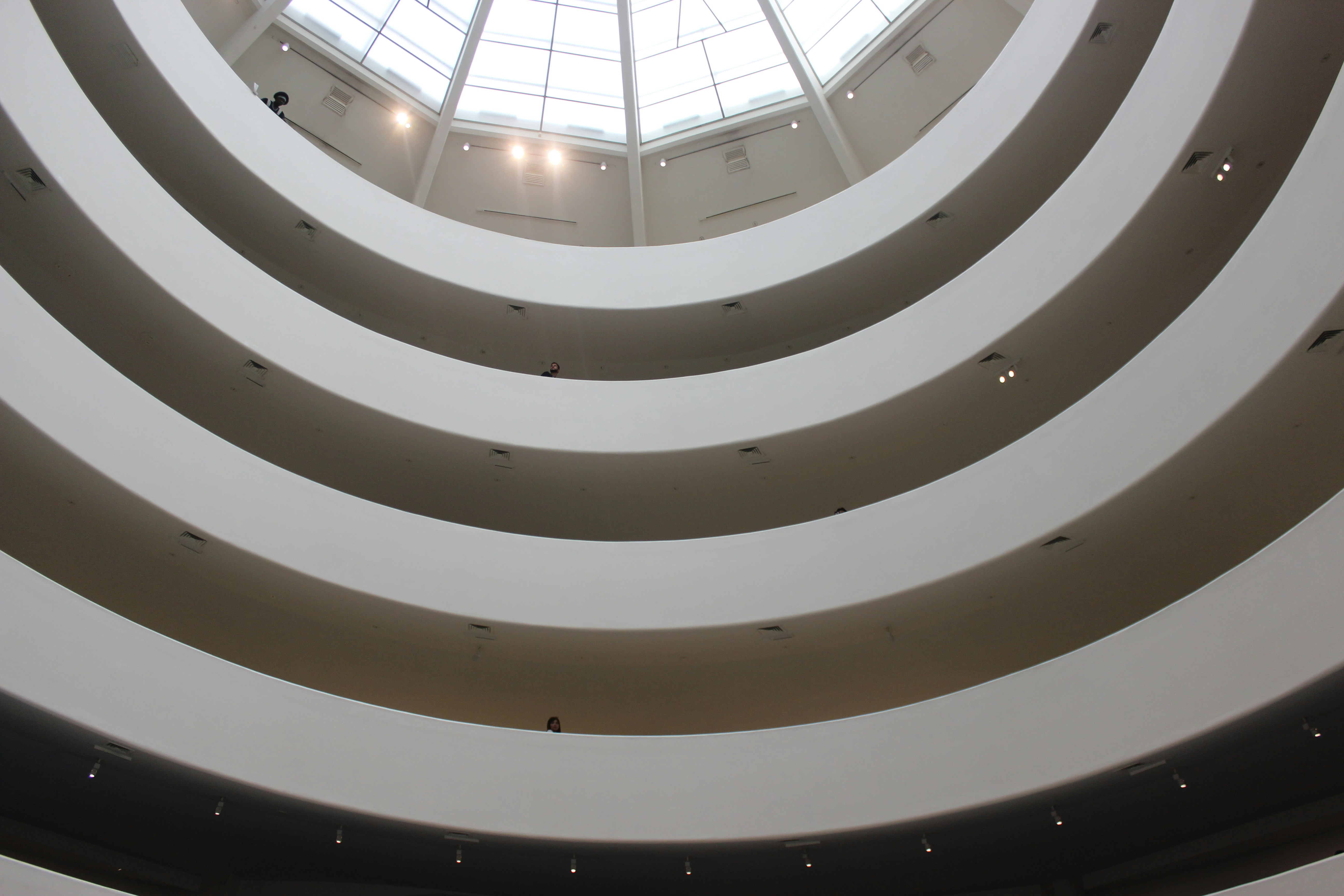 a large circular room with a skylight above it