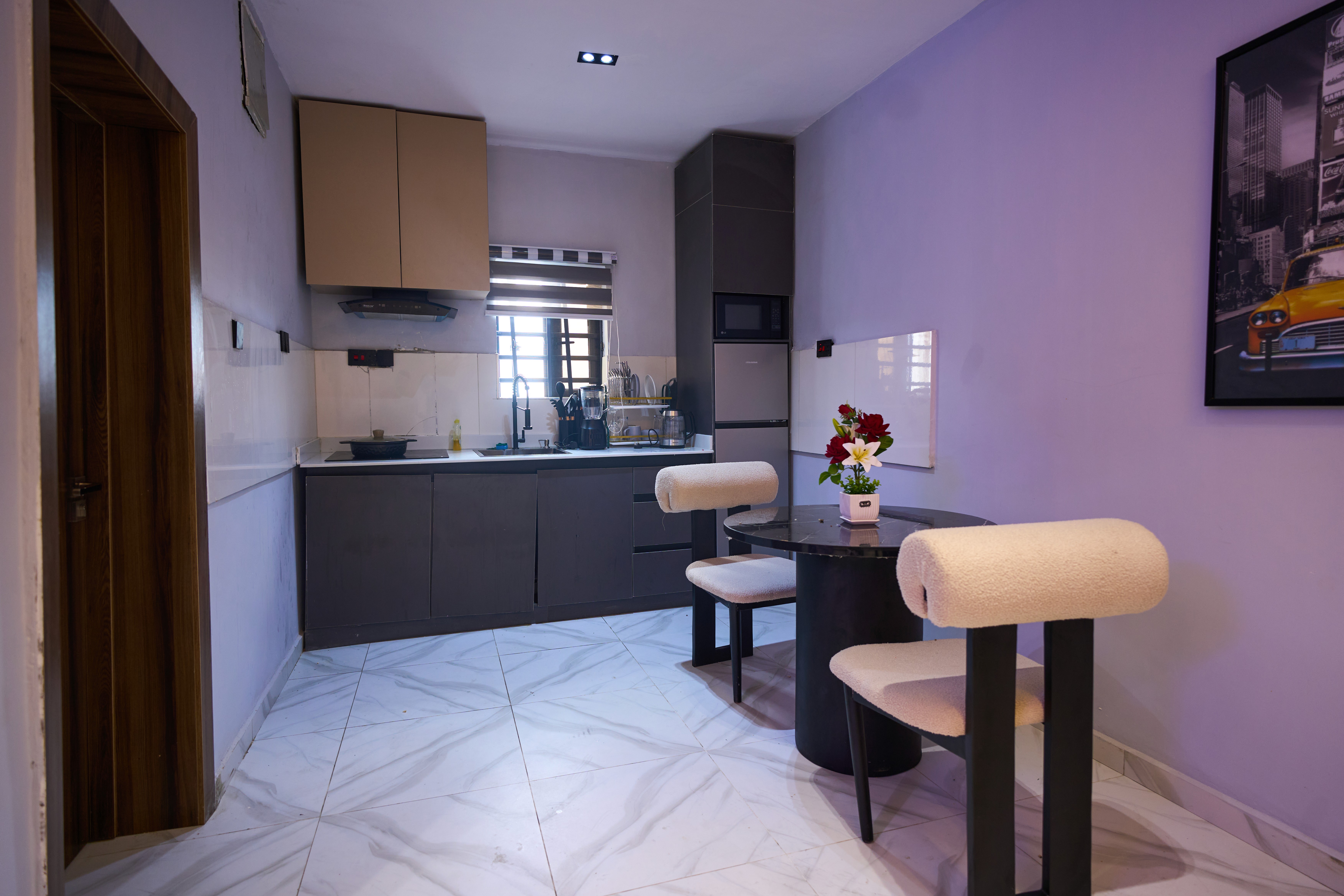 Modern kitchenette at Urban Suites, one-bedroom shortlet apartment in Surulere, Lagos