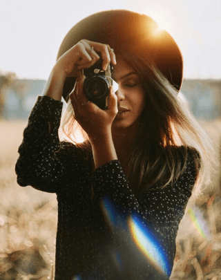 woman taking pictues with a camera