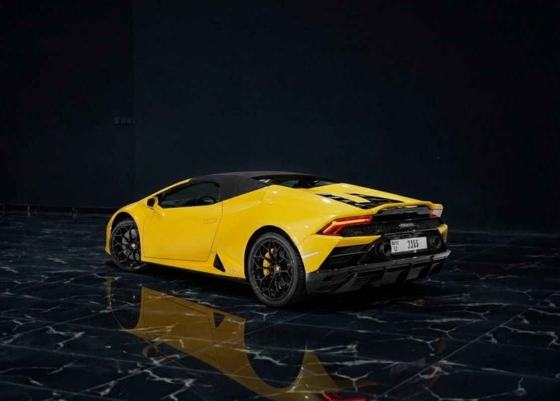 Lamborghini Huracán Spyder rear view in yellow – premium convertible car rental Dubai