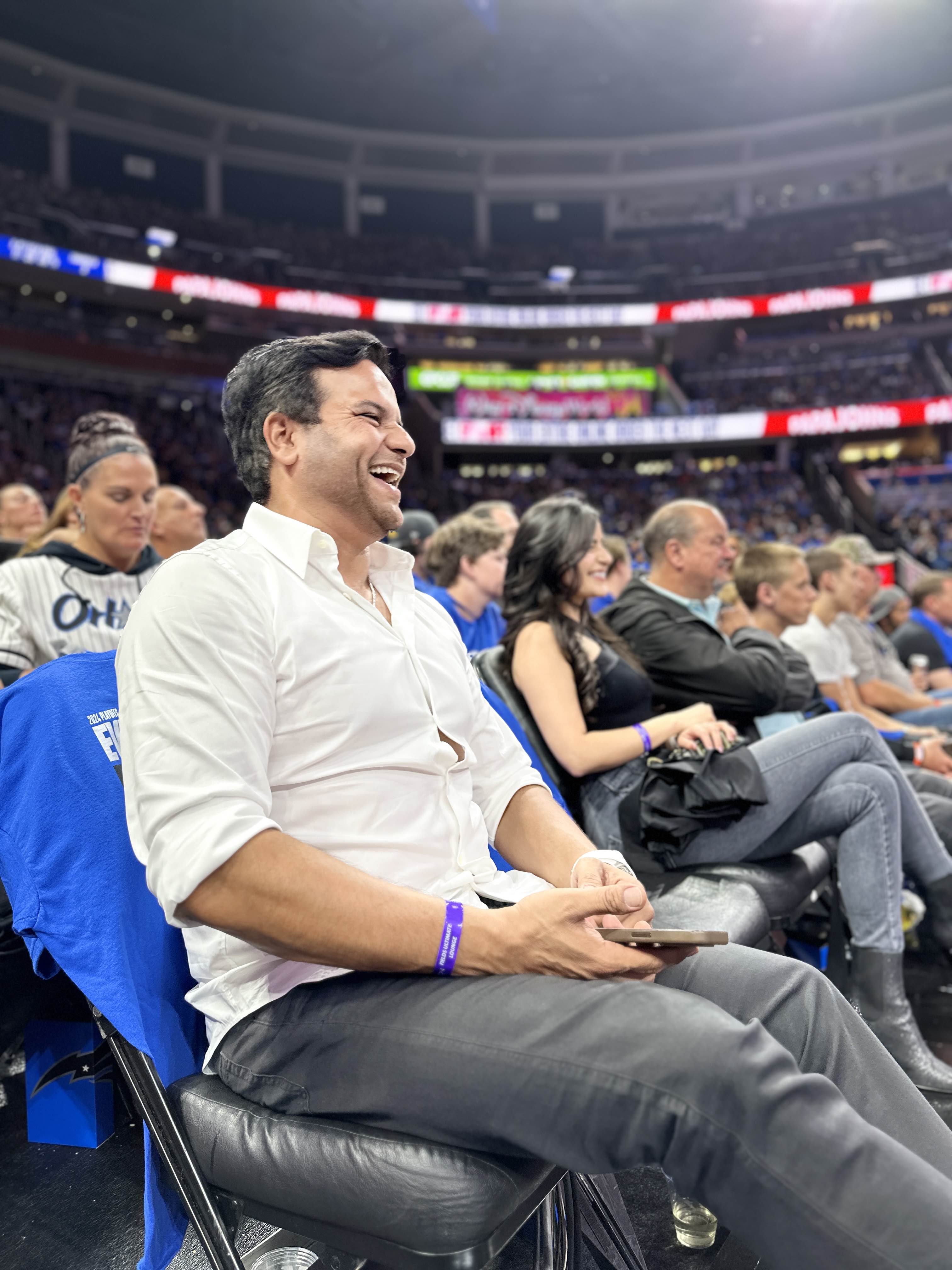 Kamran Farid sitting courtside at the Orlando Magic game.