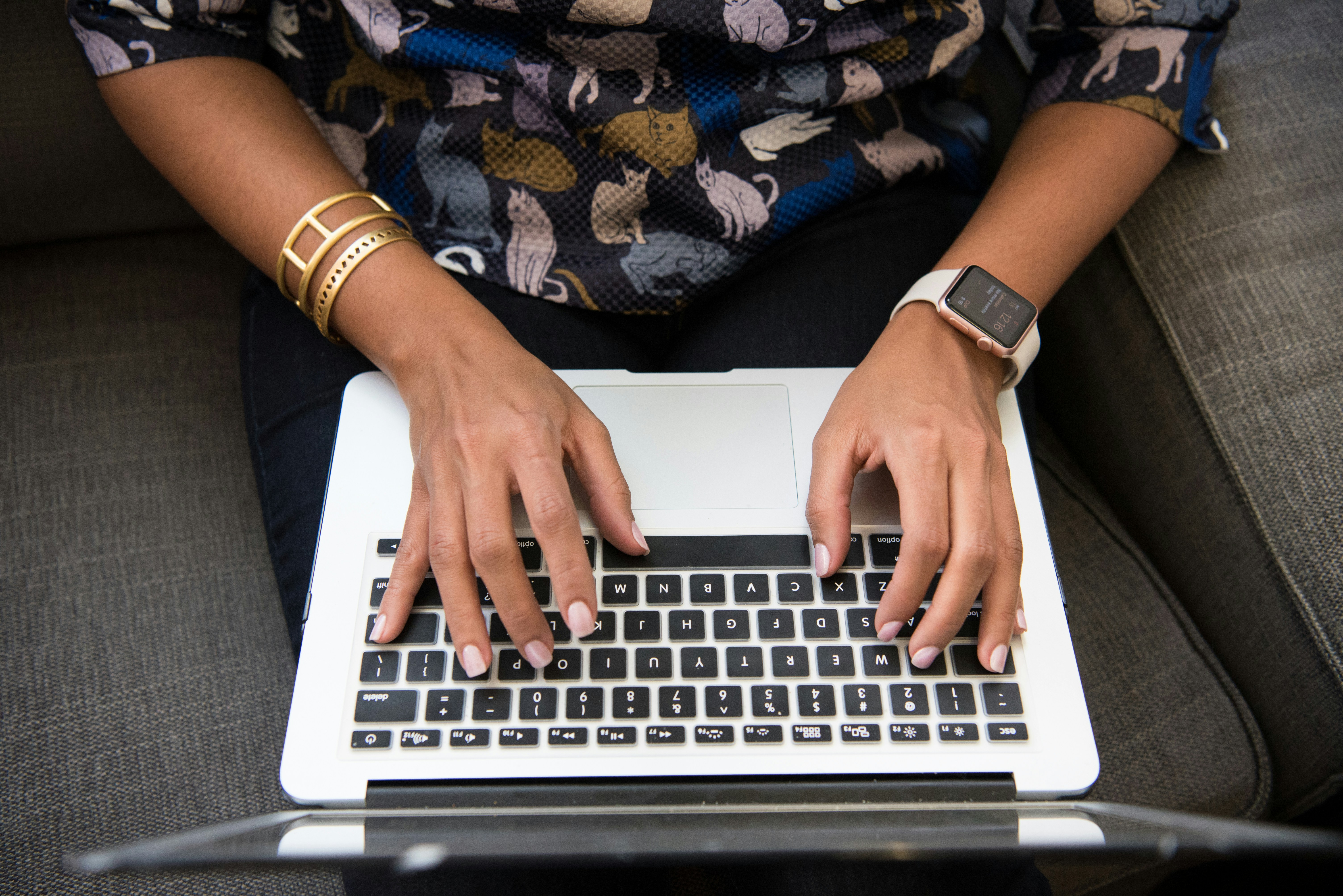 woman typing and making use of Personal Knowledge Management Software