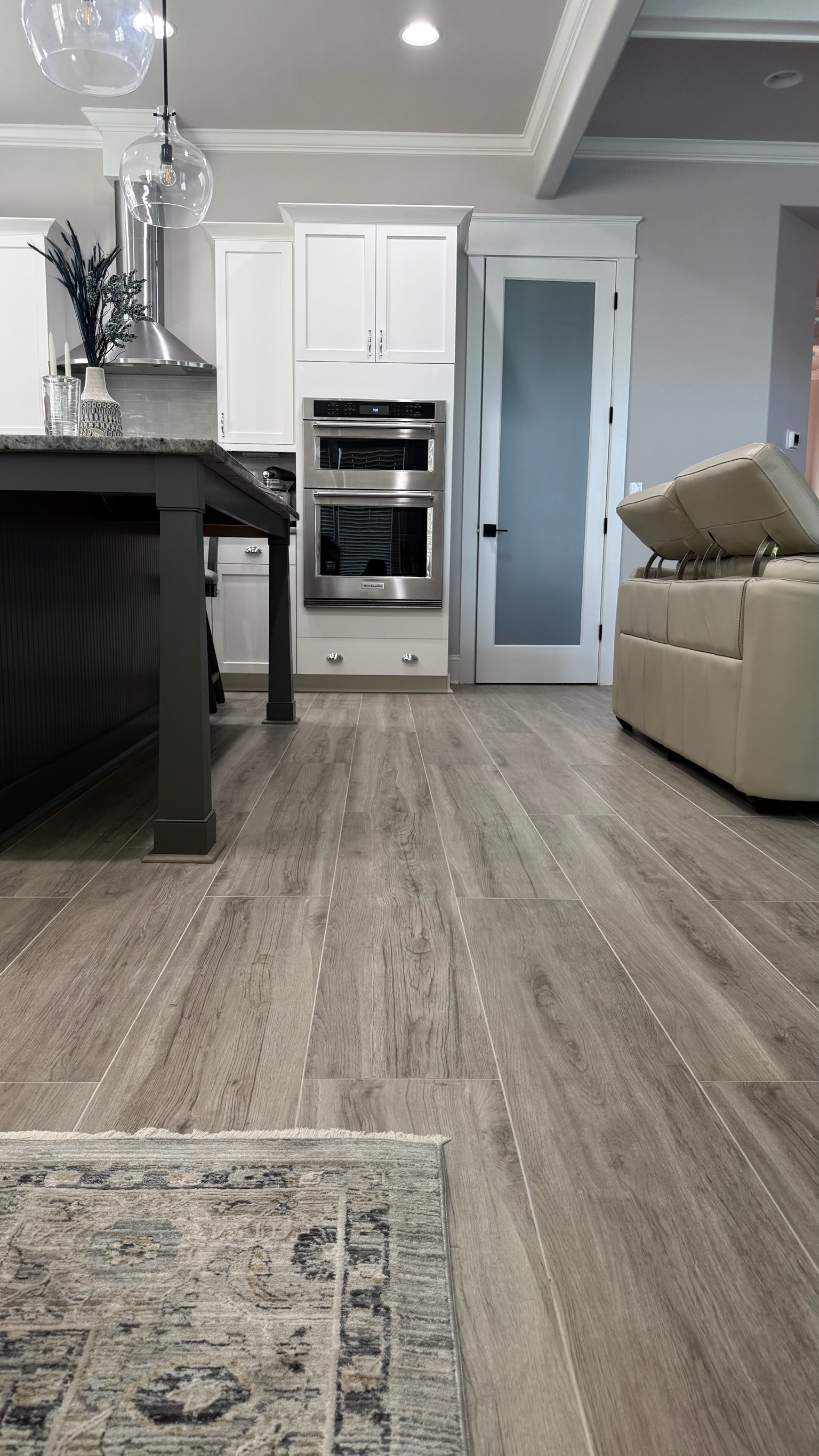 Before and after: engineered hardwood removal and tile installation in Brunswick Forest