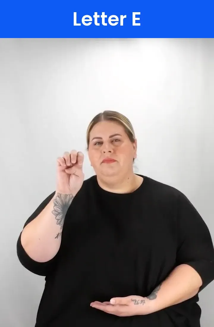 A Deaf signer signs E in ASL