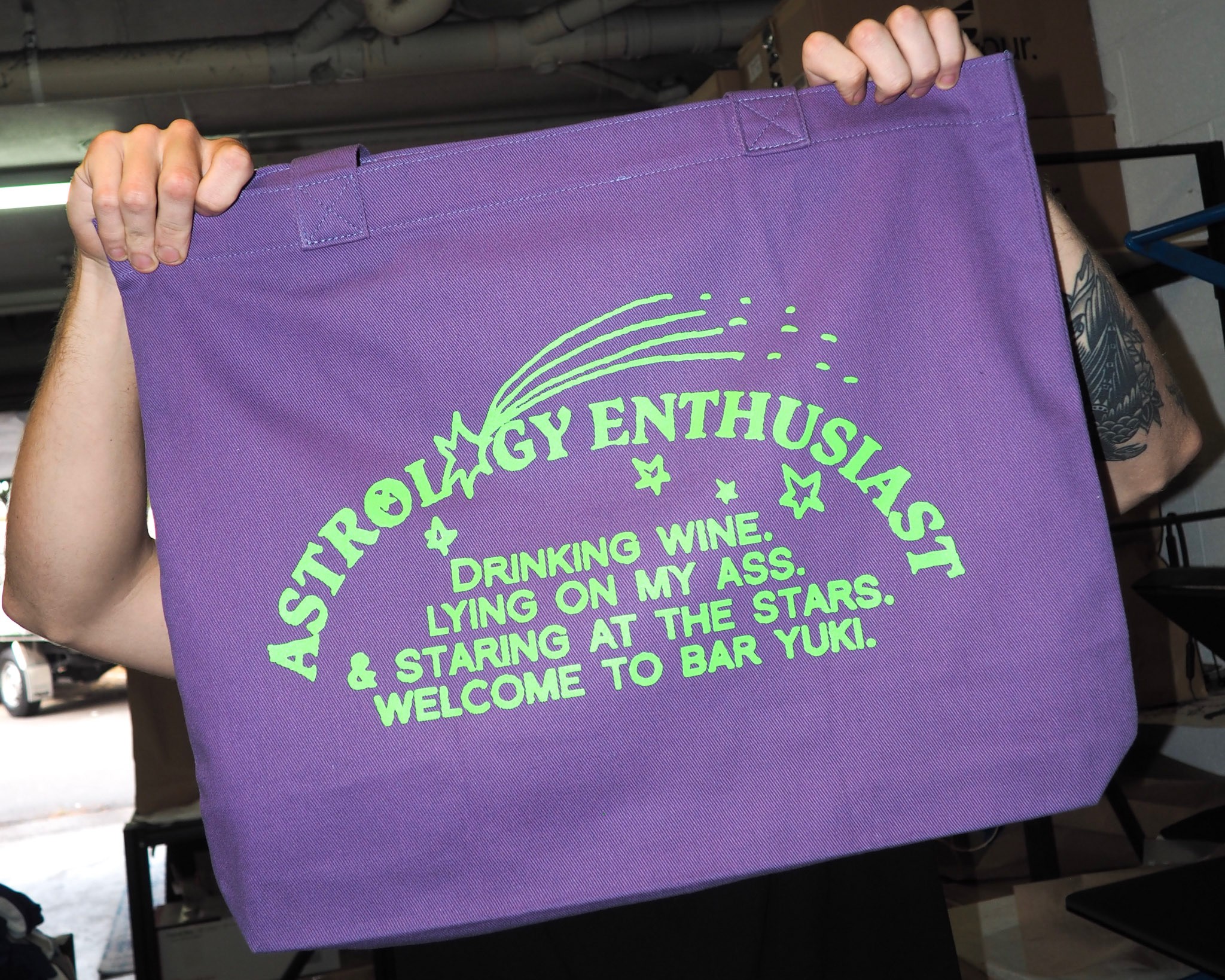 Man with camera sitting on bench