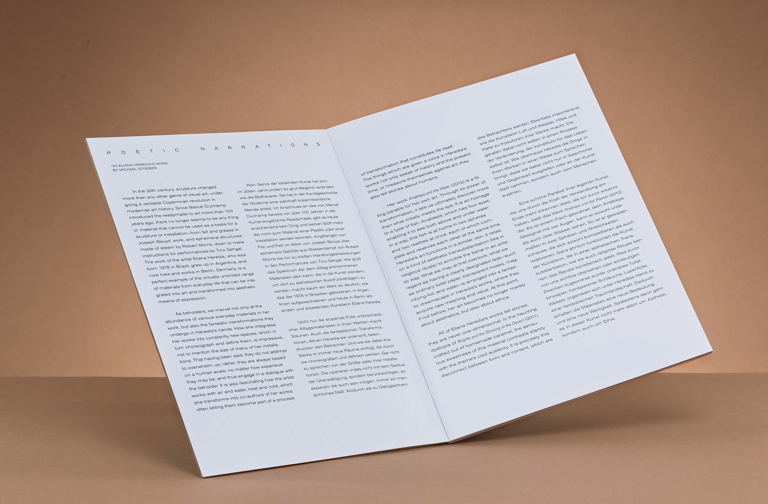 Open book displaying text on poetic narratives and sculpture, perfect for art and design websites.
