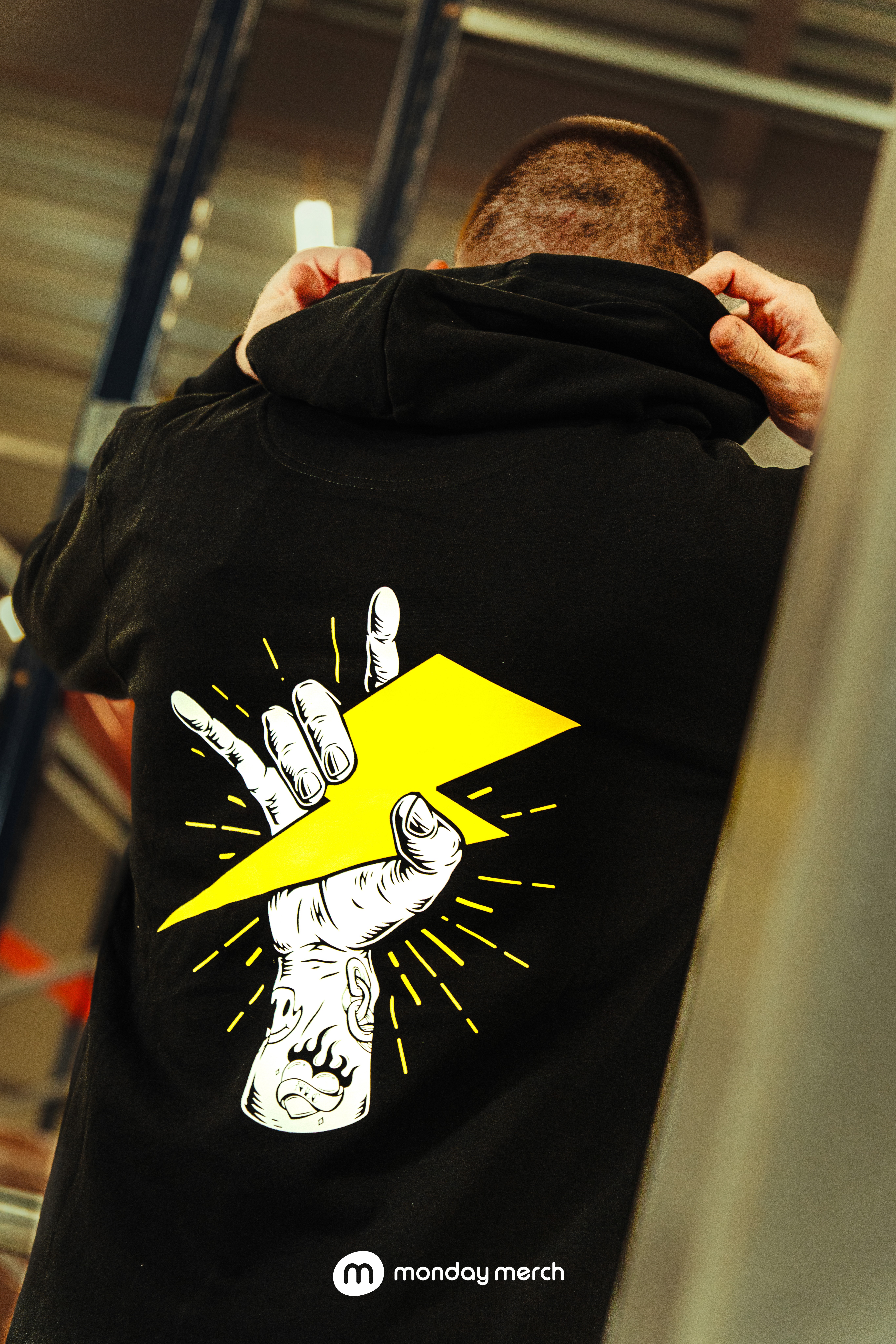 , a black jacket with a small white emblem, 